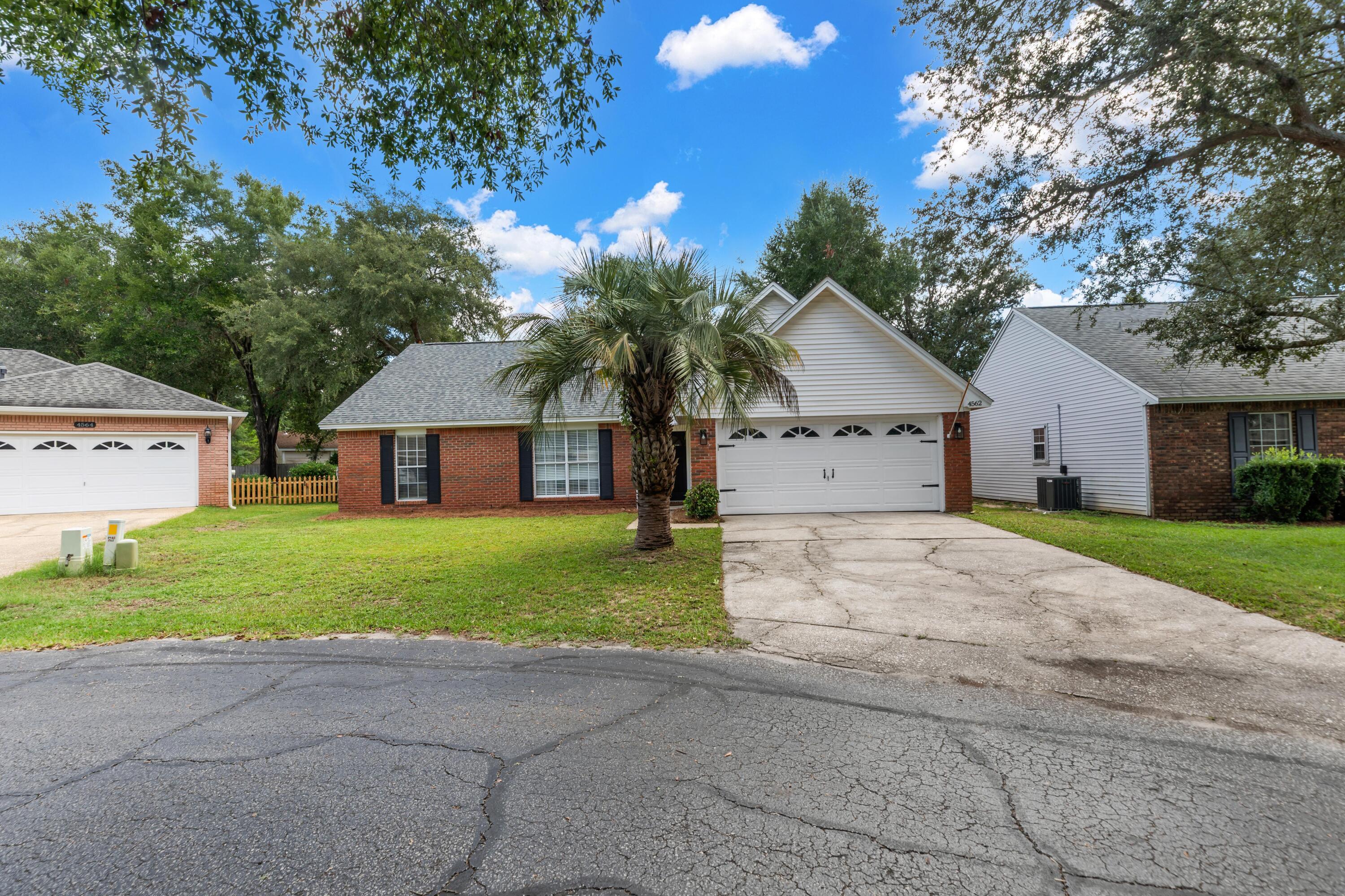 Charming 4BR/3BA brick home in Bluewater Bay on a quiet cul-de-sac. Features soaring ceilings, updated granite kitchen, screened porch, first-floor master, & open loft. Walk to top schools & golf; under 15 mins to Destin beaches. Move-in ready!