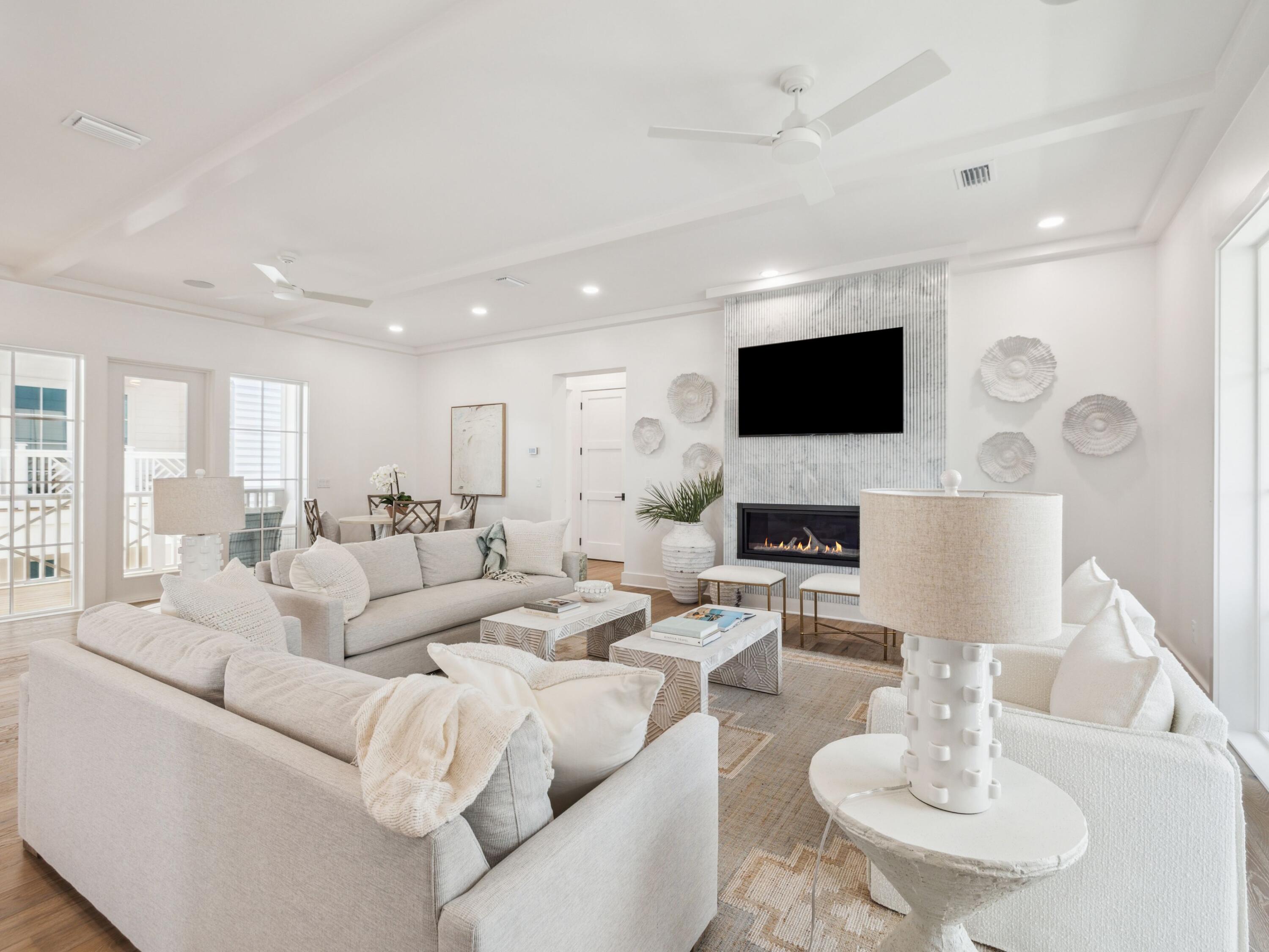 An extraordinary opportunity to own a premier residence on 30A, where tranquil Allen Lake lakefront living blends seamlessly with the ease of coastal convenience. Just a one-minute over to public beach access and steps from the celebrated 30A bike trail, this exceptional home sits on 74 feet of rare Allen Lake coastal dune lakefront--offering privacy, breathtaking water views, and a front-row seat to the natural beauty of the Emerald Coast. Enjoy peekaboo views of the golf course, adding yet another scenic element to this exceptional coastal retreat. Spanning more than 5,866 square feet, the residence features six generously sized bedrooms, seven full bathrooms, and two spacious bunk rooms, comfortably sleeping up to 20 guests, making it ideal for large family gatherings or exceptional vacation rental potential. Sun-drenched interiors are thoughtfully designed to balance refined elegance with relaxed coastal living, showcasing expansive gathering spaces, a gourmet kitchen crowned by a striking marble island, a fireside living room, and premium finishes throughout. A luxurious primary retreat features a spa-inspired ensuite bath with a freestanding soaking tub and glass-enclosed shower.

Step outside to a private pool where sunsets over the serene lake become a daily ritual, and morning coffee or evening gatherings unfold in the peace of your own backyard. Direct lake access invites kayaking and paddleboarding at leisure, while multiple covered balconies capture shimmering glimpses of the Gulf beyond. Nearby, iconic 30A communities, scenic trails, and beloved local dining offer endless ways to savor the coastal lifestyle.

Whether envisioned as a private family retreat or a forever home, 58 Woodward Drive delivers an unmatched union of luxury, location, and lifestyle--a rare offering on the Emerald Coast that promises a lifetime of memories.