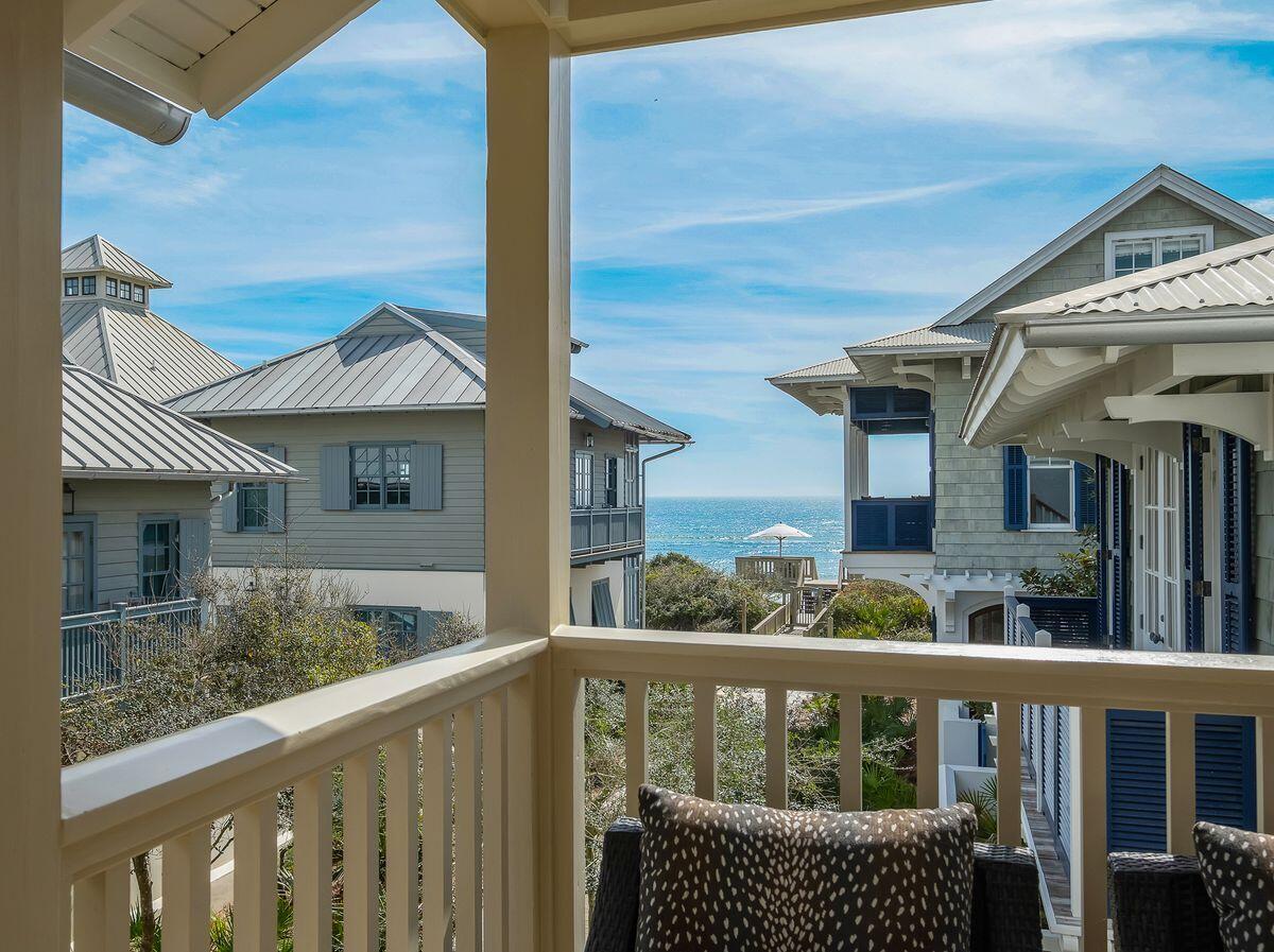 Just one home from the Gulf with beautiful beach views, this exceptional Rosemary Beach retreat represents the lowest priced home in Rosemary Beach with Gulf views. Celebrated for its vibrant, curated interiors, the home has been featured in design books and magazines alike, including House Beautiful and Vern Yip's recently released book Color, Pattern, Texture.

Thoughtfully redesigned by HGTV interior designer Vern Yip, the home blends elevated design with a playful beachside personality that makes it both stylish and welcoming.

Recent updates include a new roof, fresh interior and exterior paint, kitchen appliances, quartz countertops, refreshed baths, new lighting, door hardware, window and wall coverings, and all new furnishings. The main house comfortably sleeps 12 with three bedrooms plus a spacious sleepover and entertainment room accommodating four additional guests. A carriage house above the one car garage offers Gulf views from its balcony and provides a private guest suite for two with a full kitchen, living area, bar seating for dining, bedroom and bath.

The front door opens directly to the boardwalk just steps from the beach, while the second floor porch off the main living area offers a wonderful place to relax and take in Gulf views without leaving home.

A home this close to the Gulf in Rosemary Beach is a rare and highly desirable opportunity.