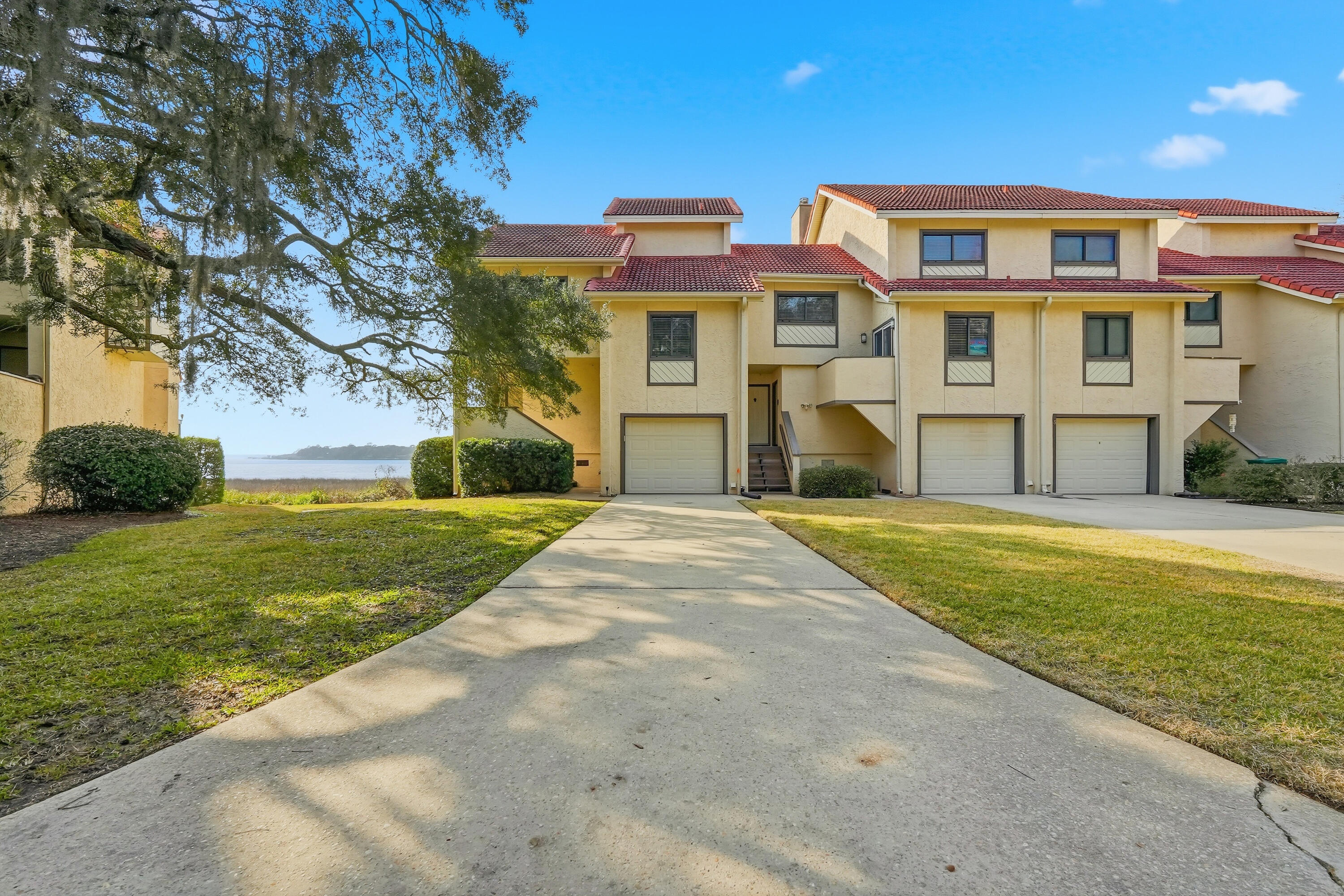 Stunning END UNIT waterfront townhome in the heart of Bluewater Bay, offering breathtaking views of the Choctawhatchee Bay and an effortless coastal lifestyle. End units like this one rarely come available.  This beautifully renovated three-bedroom, three-and-a-half-bath residence features modern finishes throughout and outdoor living spaces perfectly positioned to take in the water views.
Step inside to a fresh, bright, and airy interior highlighted by luxury vinyl plank flooring, updated lighting, and a cozy wood-burning fireplace anchoring the main living space. The open kitchen is designed to impress with stone countertops, designer backsplash, crisp white cabinetry, stainless steel appliances, and a dedicated dining area. A comfortable sitting room just off the kitchen and living area creates additional space to relax or entertain while enjoying the scenery. Carpeted stairs and bedrooms lead to a second-floor loft on the landing with vaulted ceilings, offering flexible space for a home office or reading nook. The primary suite is a true retreat with vaulted ceilings, stunning bay views, sleek countertop in en suite, a large vanity, bath-shower combo, and a walk-in closet. An additional bedroom is thoughtfully designed, including a third full bath with a convenient walk-in shower and upgraded carpet. Additional highlights include premium rated storm windows and doors, single-car garage, abundant storage, and a long driveway for extra parking. The HOA provides lawn care and pest control, allowing for low-maintenance living.  Ideally located within walking distance to the marina, this waterfront townhome offers the perfect blend of comfort, style, and coastal convenience!  Contact us for your showing today!!