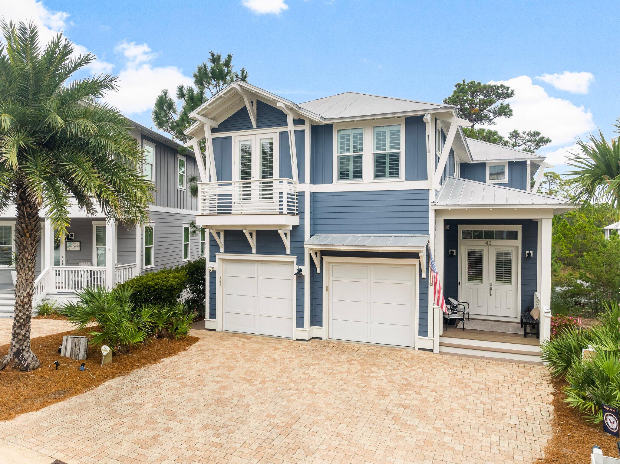 Exceptional privacy meets refined coastal living on what is arguably one of the best lots in Highland Parks -- a serene pond-front setting bordered by lush state forest with no rear neighbors. This beautifully maintained home offers a rare combination of thoughtful design, quality finishes, and major recent upgrades throughout.

The expansive open floor plan flows effortlessly between living, dining, and entertaining spaces, all finished with wood-look porcelain tile -- delivering the warmth of hardwood with superior durability. Designer plantation shutters throughout add a classic coastal elegance to every room.

The gourmet kitchen is a chef's dream, featuring a pot filler and generous space for cooking and gathering. Four oversized bedrooms and a large dedicated laundry room provide all the space a family or vacation home could need.

Outdoor living is where this home truly shines. A spectacular 10×20 porch off the living room overlooks the tranquil pond and state forest -- perfect for morning coffee or evening entertaining year-round.  Beautiful full wall gas fireplace in the living room provides elegance and warmth in the cooler months.   The primary suite enjoys its own private screened porch, a peaceful retreat with serene natural views. A large welcoming front porch and an expansive back porch complete an outdoor living package that is simply unmatched in this neighborhood.   This home has never been in a rental program, however it is perfect for short term rental Nestled in the sought-after Highland Parks community, you'll enjoy access to unbeatable amenities, including a world-class heated pool, a beach-viewing tower to soak in breathtaking sunsets, and a pavilion designed for grilling and entertaining. This is more than a home it's a lifestyle waiting to be embraced.