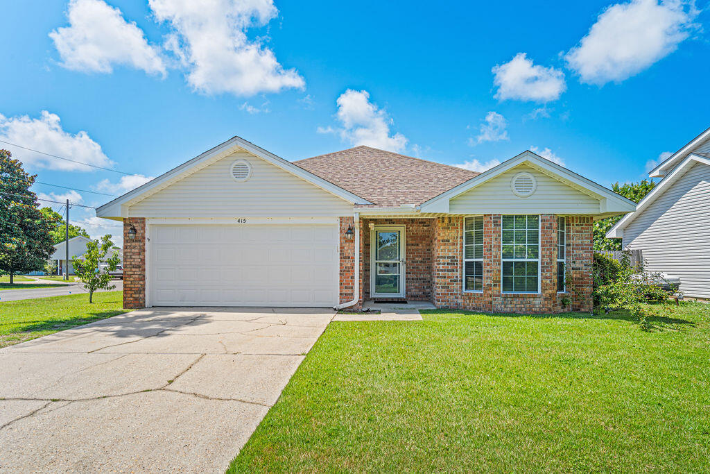 From the marble showers to the fruit trees in the backyard, this all-brick Mary Esther home is packed with upgrades that make everyday living a little more enjoyable.
This all-brick, 3-bedroom, 2-bath home is located less than 15 minutes from Hurlburt Field and offers a well-designed floor plan with wood-look tile flooring throughout for easy maintenance. No carpet to hold onto all of the Florida sand. 

The kitchen features solid wood cabinetry, Sea Pearl quartzite countertops, stainless steel appliances, and a deep pantry. The spacious primary suite includes a beautifully updated bathroom with a marble walk-in shower, dual vanities, and a pocket door for added privacy. The guest bathroom has also been upgraded with marble finishes and a cast-iron tub.

Additional features include remote-controlled ceiling fans, storm doors with hidden screens, a two-car garage, and established landscaping highlighted by fruit trees and a Southern Magnolia. A double gate provides access to a dedicated parking pad in the backyard, creating space for a boat, RV, trailer, or additional vehicles.

With quality finishes, functional upgrades, and room for your outdoor toys, this home offers a combination of comfort and convenience that's hard to find.