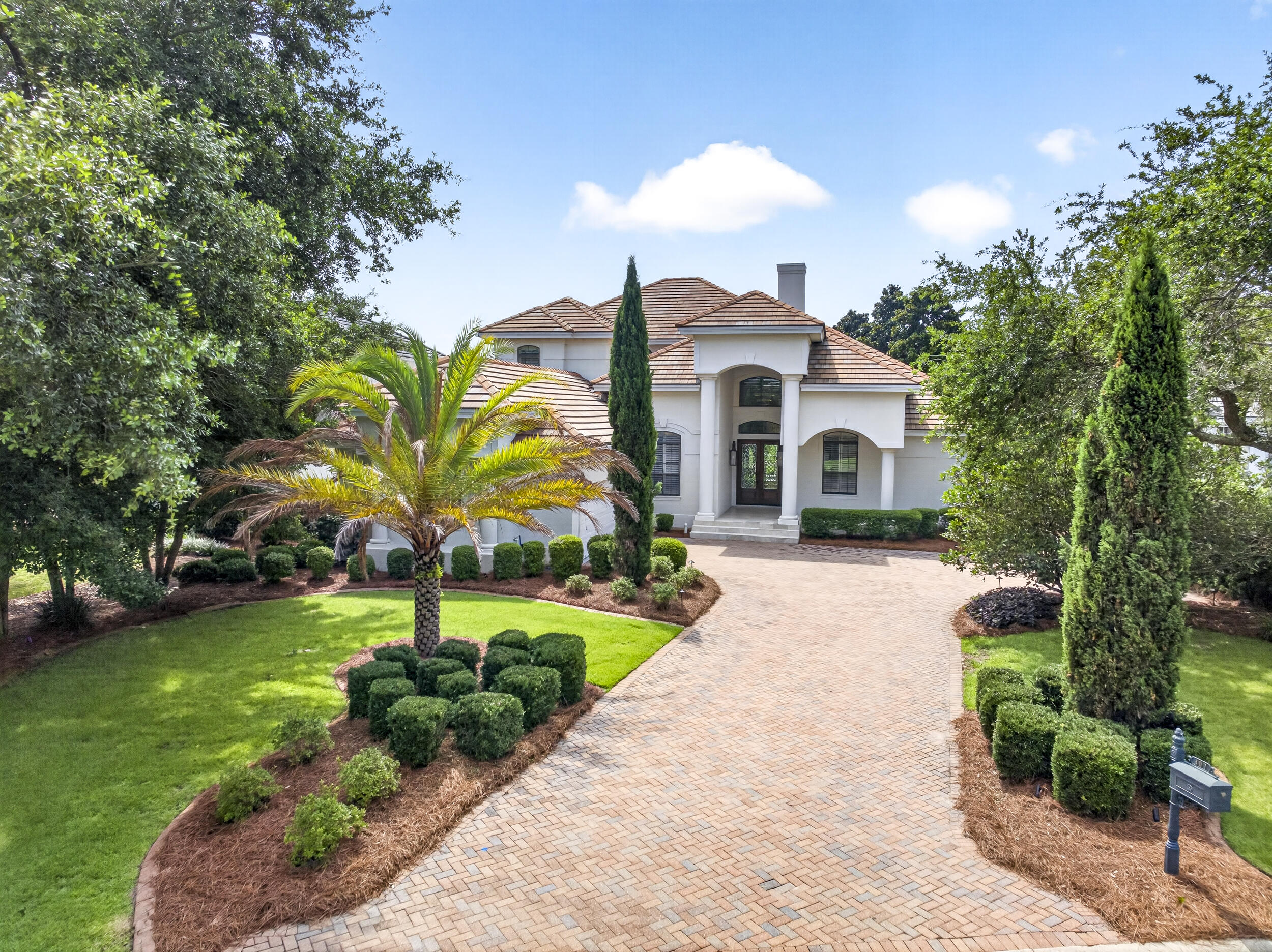 Luxury 4BR/4BA golf course home with lake views in the gated Regatta Bay community of Destin. Perfectly positioned along the 15th green of the award-winning 18-hole golf course, this private two-story residence features soaring 22-foot ceilings, a first-floor primary suite, dedicated office, remodeled heated pool and spa, outdoor kitchen, screened porch, renovated climate-controlled 2-car plus golf cart garage with epoxy floors, new flooring throughout, and fully remodeled bathrooms.

The open-concept floor plan showcases crown molding, custom millwork, a dramatic 22-foot fireplace, quartz countertops, Wolf appliances, Sub-Zero refrigerator, and a luxurious primary suite with a spa-inspired bathroom, dual walk-in closets, and direct access to the pool area. Upstairs offers additional living space ideal for guests, a media room, or a second family room.

Just minutes from Destin's white-sand beaches, shopping, dining, and entertainment. Regatta Bay amenities include an 18-hole golf course, marina, boat launch, waterfront access, fishing dock, clubhouse, resort-style pool, tennis courts, pickleball courts, playground, game room, and 24-hour gated security. Pet-friendly community. No short-term rentals allowed.