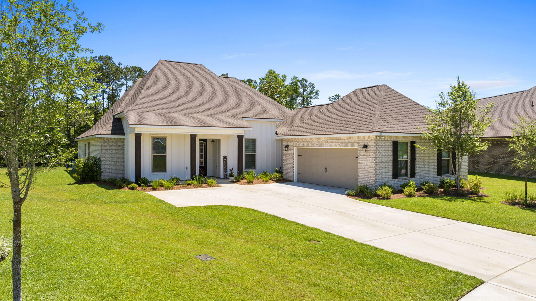 Welcome Home to this stunning 4 bedroom, 3 bath residence w/flex rm in the highly sought-after Wildflower neighborhood in Hammock Bay! Beautiful 2024-built  home backs directly to peaceful preserve, offering serene privacy and breathtaking natural views right from your backyard. Step outside to your expansive screened porch, perfect for morning coffee and evening relaxation. Inside, the chef's fantasy kitchen takes center stage with an oversized island, abundant cabinetry, organizational work station, spacious corner pantry and premium finishes. With high ceilings and an open layout, this 2604 sq ft Renoir floorplan features a flex space ideal for a home office, formal dining or playroom. Custom, all-wood shelving throughout the home adds warmth and quality. Hammock  Bay is a premier master-planned community nestled in Freeport, Florida, offering resort-style living with low HOA fees.  Residents enjoy access to top-tier amenities including community pools, sports complexes, nature trails and more, all while being just 25 minutes from the sugar-white sands and emerald waters of 30A. This family-friendly oasis provides sidewalks, and a vibrant social calendar provided monthly by our full-time Event Coordinator.  In the Windmills in Town Center we enjoy concerts, farmers' markets, holiday festivals all while enjoying the Brewery, General Store, food and coffee trucks, etc.  We have three clubhouses, dog parks, pickleball, four swimming pools, and a 24/7 8,000 SF fitness center, just to name a few amenities! Come see 77 Flora Lane today! Buyer to verify all dimensions and information important to them.