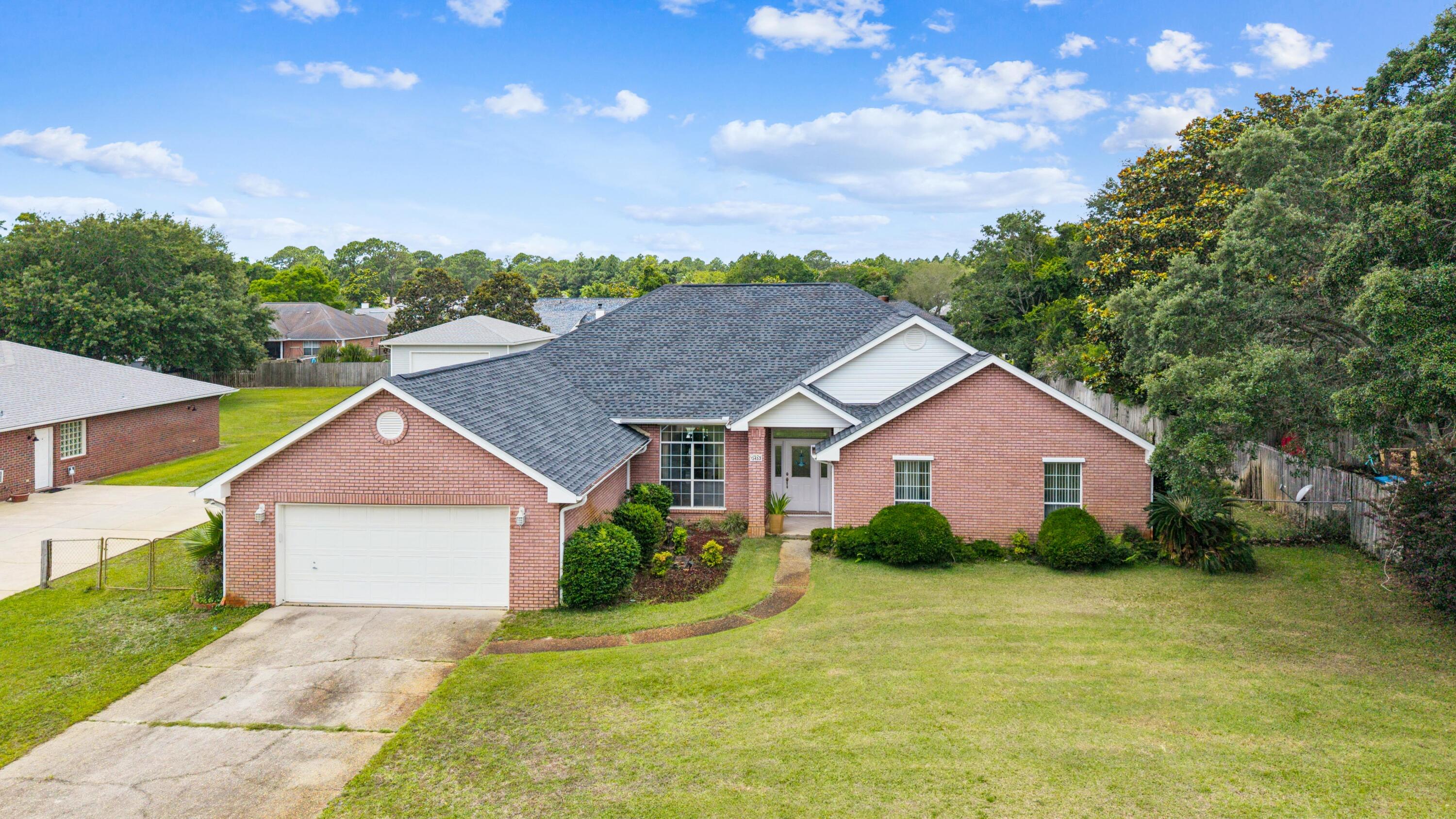 Welcome to this immaculate, custom-built, home located in the highly desirable Sound Retreat community of Navarre, offering the perfect blend of coastal charm and absolute peace of mind. Sitting high and dry with no history of flooding, this property features major recent upgrades for worry-free living, including a brand-new roof and a new hot water heater, both installed in 2025. Best of all, you are just a short, scenic stroll away from the beautiful Santa Rosa Sound. This home is complete with deeded water access for Sound Retreat neighbors to enjoy the very best of the coastal lifestyle. Walk down to the water easily from this home and watch the sunrise or sunset! Another reason to love this home is that it is officially zoned for the highly anticipated new Soundside High School. Inside, the exceptionally spacious, open-concept layout is designed with large, airy rooms, flowing effortlessly from the massive great room into a separate formal dining room and a bright eat-in kitchen. The highly unique floor plan boasts two true master suites. One situated on either end of the house for ultimate privacy--with each suite opening up through French doors to its own private lanai. Rounding out this incredible property is an oversized garage and a LARGE backyard (almost a half an acre!). From its pristine condition to its unbeatable location and recent improvements, this spectacular home is entirely move-in ready and just waiting for a new owner to enjoy it. Schedule today!
