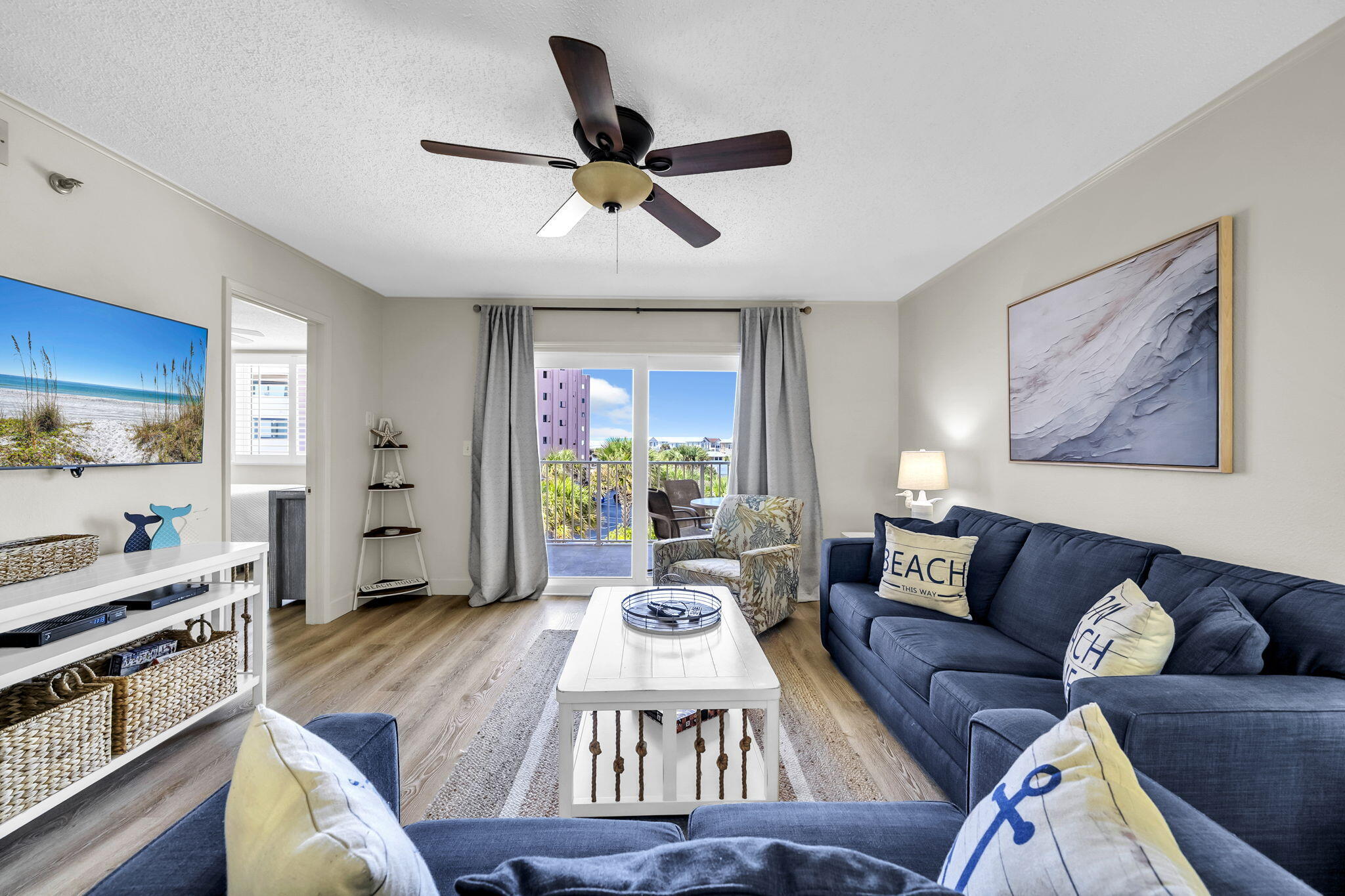 Discover Islander 311, a beautifully updated condominium at Islander Beach Resort offering an exceptional combination of Gulf, lake, pool, and resort views. This spacious two-bedroom, two-bath residence comfortably accommodates up to six and is ideally suited for a full-time residence, second home, or investment property. The thoughtfully designed floor plan features a king primary suite with beautiful Gulf, lake, and resort views, along with a second king bedroom that comfortably accommodates family, guests, or offers additional flexibility. The living area includes a sleeper sofa and opens to a large private balcony, where the expansive Gulf, lake, and pool views create an inviting outdoor living space. The interior has been thoughtfully updated with a fully stocked kitchen and luxury vinyl plank flooring throughout the entire residence. There is no carpet or tile, providing a clean, contemporary look that is also easy to maintain. Smart TVs are located in the living room and bedrooms, adding modern convenience. One of the property's standout features is its convenient beach access. Owners and their guests can reach the beach without having to cross a busy road, making access to the Gulf exceptionally easy. Ownership at Islander Beach Resort includes access to an impressive collection of resort amenities, including two swimming pools, two hot tubs, a fitness center, tennis and pickleball courts, a half basketball court, BBQ grills and picnic areas, a gated and secure property, and beautifully maintained tropical landscaping. The combination of extensive amenities, attractive grounds, convenient beach access, and exceptional Gulf and resort views makes Islander 311 a compelling opportunity for those seeking a coastal condominium with both lifestyle appeal and flexibility. With its updated interior, two king bedrooms, spacious private balcony, desirable Gulf and lake views, and extensive resort amenities, Islander 311 offers an opportunity to own a well-appointed beach condominium in a sought-after resort setting.