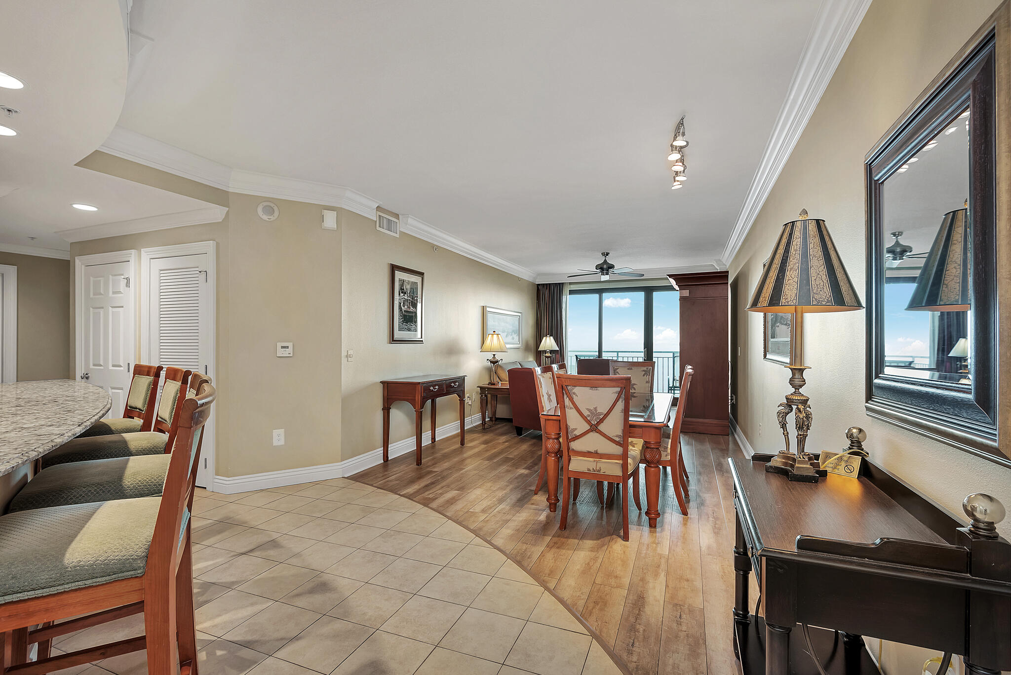 STRONG RENTAL PERFORMER! Sparkling water views, unforgettable sunsets, and the energy of Destin's waterfront come together at Emerald Grande W1029. This fully furnished, 3-bedroom, 3-bath residence offers 1,566 square feet of coastal comfort with beautiful views of the Gulf, East Pass, harbor, and bay. Step onto either of two private balconies and watch boats glide across turquoise waters as golden sunlight gives way to shimmering harbor lights. From morning coffee in the coastal breeze to sunset cocktails overlooking the water, every day feels like a getaway. Inside, the open-concept living and dining areas provide an inviting space to gather, while raised ceilings and crown molding add a refined touch. The kitchen's breakfast bar keeps conversation flowing, whether preparing breakfast before a beach day or gathering for an evening in. Spacious bedrooms, three full bathrooms, and an in-unit washer and dryer provide comfort and convenience for owners and guests alike. Offered fully furnished, this residence blends the appeal of a personal coastal retreat with vacation rental ownership. Emerald Grande's resort amenities include indoor and outdoor heated pools, hot tubs, a full-service spa, and a fitness center. Just downstairs, HarborWalk Village puts waterfront dining, shopping, live entertainment, fishing charters, and dolphin cruises within easy reach.