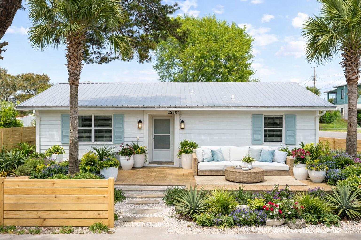 Tucked away on the growing west end of Panama City Beach, just moments from the sugar-white sands of the Gulf and ideally positioned east of 30A and Inlet Beach, this charming coastal cottage offers an exceptional blend of lifestyle, location, and investment potential. Set on a spacious corner lot in a quiet, golf cart-friendly neighborhood, the property invites a relaxed, easygoing coastal experience while remaining just minutes from the dining, shopping, and energy of 30A. Whether you're seeking a primary residence, second home, or income-producing investment, this location delivers on every level. Inside, the home features an open, functional layout with abundant natural light offering the perfect canvas to create a thoughtfully designed coastal retreat. Outside, a covered patio and  expansive deck provide ideal spaces for entertaining, unwinding, and enjoying the Gulf breeze. With no HOA and no rental restrictions, the opportunities here are truly endless. Strong long-term rental potential combined with the ability to further enhance, expand, or reimagine the property makes this a standout opportunity at this price point. Whether you envision a beautifully curated full-time residence, a high-performing long term rental, or a custom coastal getaway, this property offers the flexibility and upside to bring that vision to life. At this competitive price, opportunities like this--just blocks from the Gulf and minutes to 30A--are increasingly rare.