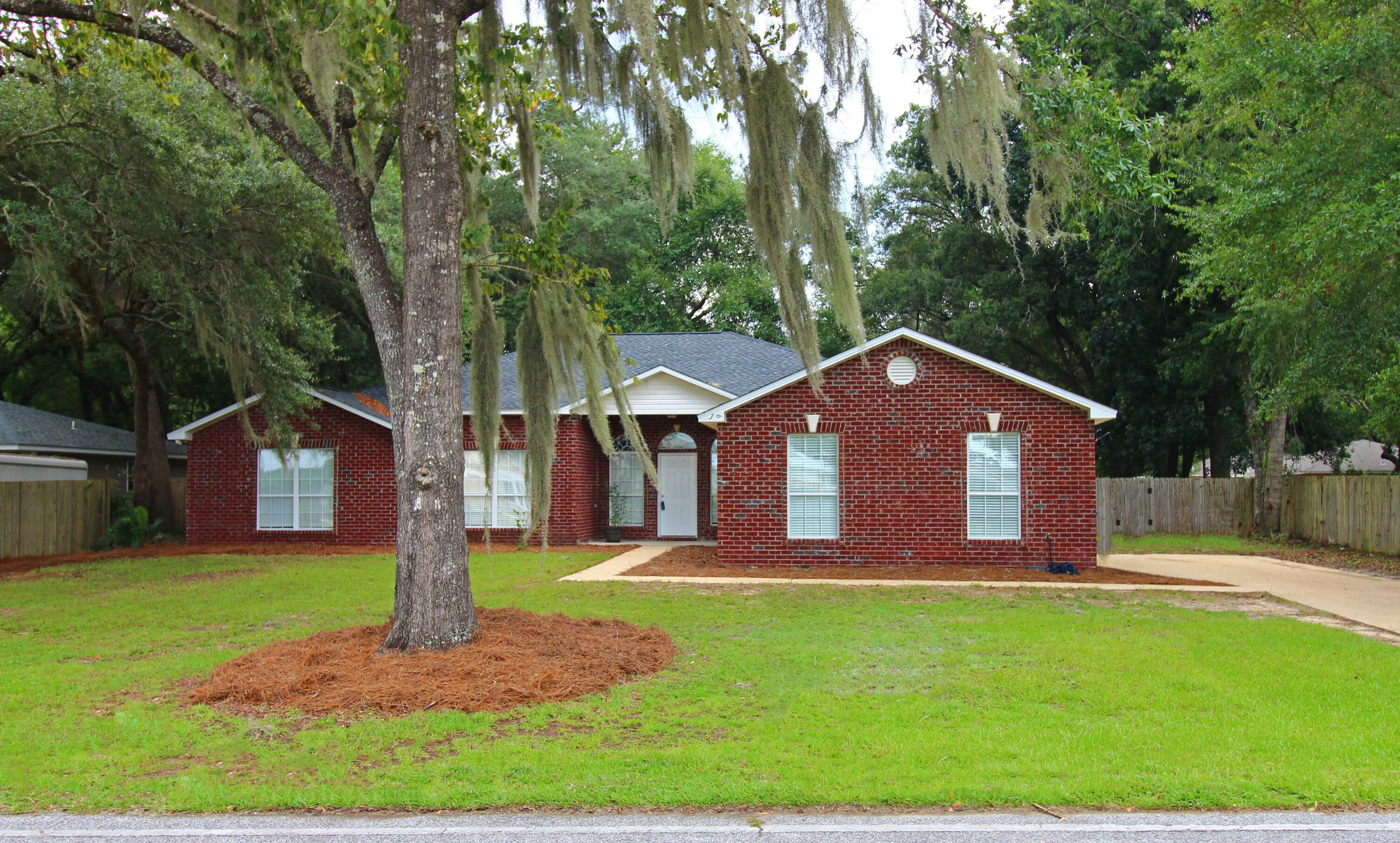 Looking for a neighborhood that has water access to the Choctawhatchee Bay? Look within Waterview Cove. This is the only 4bed 3 full bath home available here. New Roof March 2026. Situated over half an acre, this thoughtfully designed home offers approximately 2,600 square feet of comfortable living space with soaring 10-foot ceilings, fresh interior paint, and brand  new carpet in all bedrooms.
The flexible floor plan features two spacious living areas, a cozy fireplace, a formal dining room that can also serve as a home office, and an additional dining area adjacent to the large kitchen. The kitchen is designed for both everyday living and entertaining, Featuring granite countertops, a breakfast bar, abundant cabinetry, and a generous walk-in pantry.
The private primary suite includes a large walk-in closet and a luxurious ensuite bath with double vanities, a separate shower, and a relaxing corner whirlpool tub. Three additional bedrooms and two full bathrooms provide ample space for family and guests.
Step outside to enjoy the covered front porch and covered rear patio, with multiple access points including a private entrance from the primary bedroom. The fully fenced backyard offers plenty of room for outdoor activities, gardening, or pets, and the existing garden containers will convey with the property.
Additional highlights include a dedicated laundry room, attached side-entry two-car garage, oversized driveway with parking for multiple vehicles, continue... wood and tile flooring throughout the main living areas, bathrooms and laundry room.
Conveniently located near Freeport's growing amenities, schools, and the Emerald Coast's beautiful beaches, this home combines generous living space, quality finishes, and a desirable location with picturesque water views. Seller has already had the city requirement of hooking up to the public sewer and water system completed and paid tap fee.