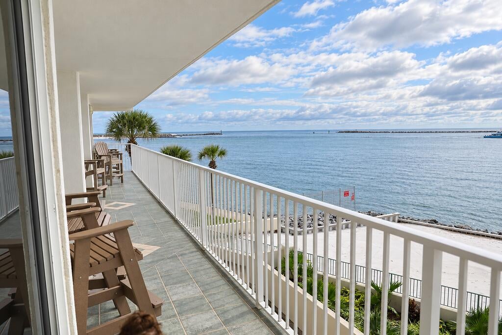 Discover an exceptional waterfront retreat at Destin's exclusive Waterview Towers, where the emerald waters of the Gulf meet the entrance to Destin Harbor. Perfectly positioned to capture the beauty and energy of the Emerald Coast, this remarkable three-bedroom residence showcases sweeping panoramic views of the Gulf, the pass, and the ever-changing maritime activity of the inlet.
A dramatic wall of inlet facing  windows bathes the interior in natural light, creating a stunning backdrop of shimmering water and passing vessels. From the spacious waterfront balcony or the comfort of the living room, enjoy front-row views of one of Destin's most captivating coastal settings. Two of the three bedrooms feature expansive sliding glass doors that open directly onto the balcony, inviting the waterfront scenery and coastal breezes into everyday living.
The thoughtfully designed floor plan features a private primary suite with an ensuite bath, complemented by two generously sized guest bedrooms connected by a Jack-and-Jill bathroom with a dedicated makeup vanity. Whether envisioned as an exclusive personal retreat or a luxurious income-producing investment, this residence offers a rare combination of comfort, location, and lifestyle. For the boating enthusiast, an exceptional amenity sets this property apart: a dedicated 25' x 13.5' boat slip in the community marina. From your own slip, Destin Harbor is just seconds away by boat, placing the area's celebrated waterfront dining, fishing charters, and vibrant harbor scene within effortless reach. By car, the harbor's renowned attractions are only minutes away.
Already established in the short-term rental market with a strong booking history, this property presents an enticing opportunity to enjoy the best of waterfront living while benefiting from established vacation-rental demand.