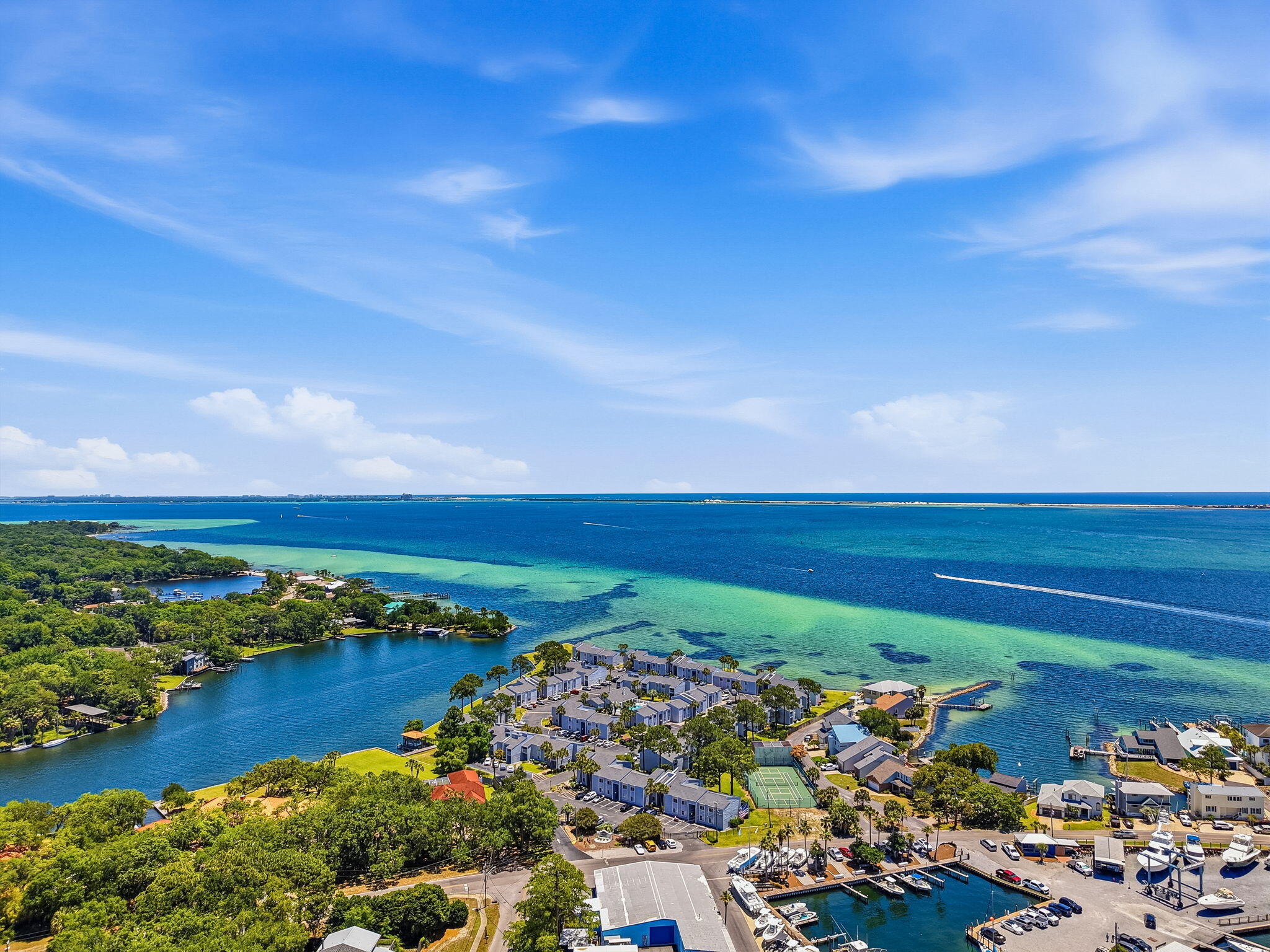 Ready to sip your morning coffee seeing dolphins from your Florida condo balcony? This bay front 2 bed 2 bath unit got it all. Pet friendly gated community in Shalimar with a community pool, tennis/pickleball court, and a dock for water access to fish and launch your kayak/paddleboard. To top it off a boat club right next door, it does not become more convenient than that. Enjoy the peace of mind of new floors, new ceiling fans, new paint, new countertops, new kitchen backsplash, a new kitchen sink, and bedroom carpets only 1 year old. Laundry facilities available and extra parking for motorcycles and golf carts!
Close to Eglin AFB, Destin FWB Airport, shopping, restaurants, and the perfect clear water sand beaches of the Emerald Coast.