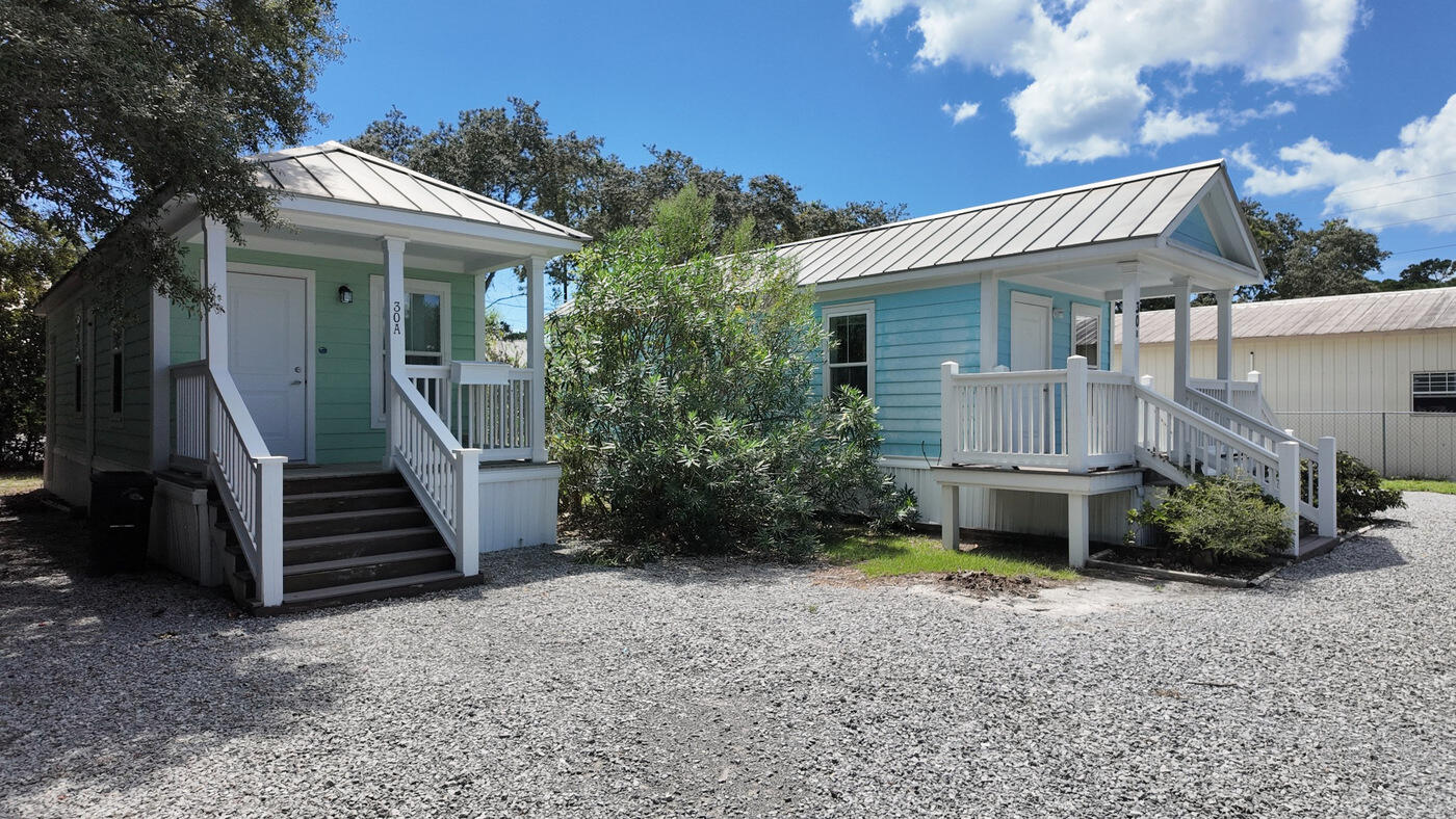 Located in South Walton County - 30 Country Club Dr - is located in the
unrecorded subdivision of Country Club Estates and offers 2 homes + 1 RV pad on one 80' x 145' (0.26-acre) lot. Each 1BR/1BA cottage is 408 sqft.

Year Built: 2010.
Interior is freshly painted, the long-term rental potential ≈ $1,650/month for each cottage. The RV pad is a real bonus & perfect to park your oversized vehicle.
Lot 2A has 2 cottages: #30A on the east side and #30B on the west side. 
Flooring in 30A is LVP and 30B has tile flooring throughout.

South Walton / Scenic 30A Location
County Hwy 393 provides a convenient Beach-to-Bay connection between Scenic Hwy 30A and the Gulf, and also Hogtown Bayou and Choctawhatchee Bay. The property is approximately 1/2 mile from Gulf Place and Ed Walline Regional Beach Access, where you can enjoy amazing seasonal sunsets and sunrises. Several additional public beach accesses are nearby.
South Walton's unique coastal dune lakes, Grayton Beach State Park and a wide selection of restaurants, shopping and recreation add to the appeal of this location. Just north on 393, Cessna Landing provides a public boat launch, recreational amenities and parking.
With no HOA, keep your boat or RV right on your own property. Short-term rentals are allowed. This section of 393 is golf-cart friendly with a nearby pedestrian/bike path. Number of bedrooms, baths and square footage is combined to include both 408sf 1/br cottages.