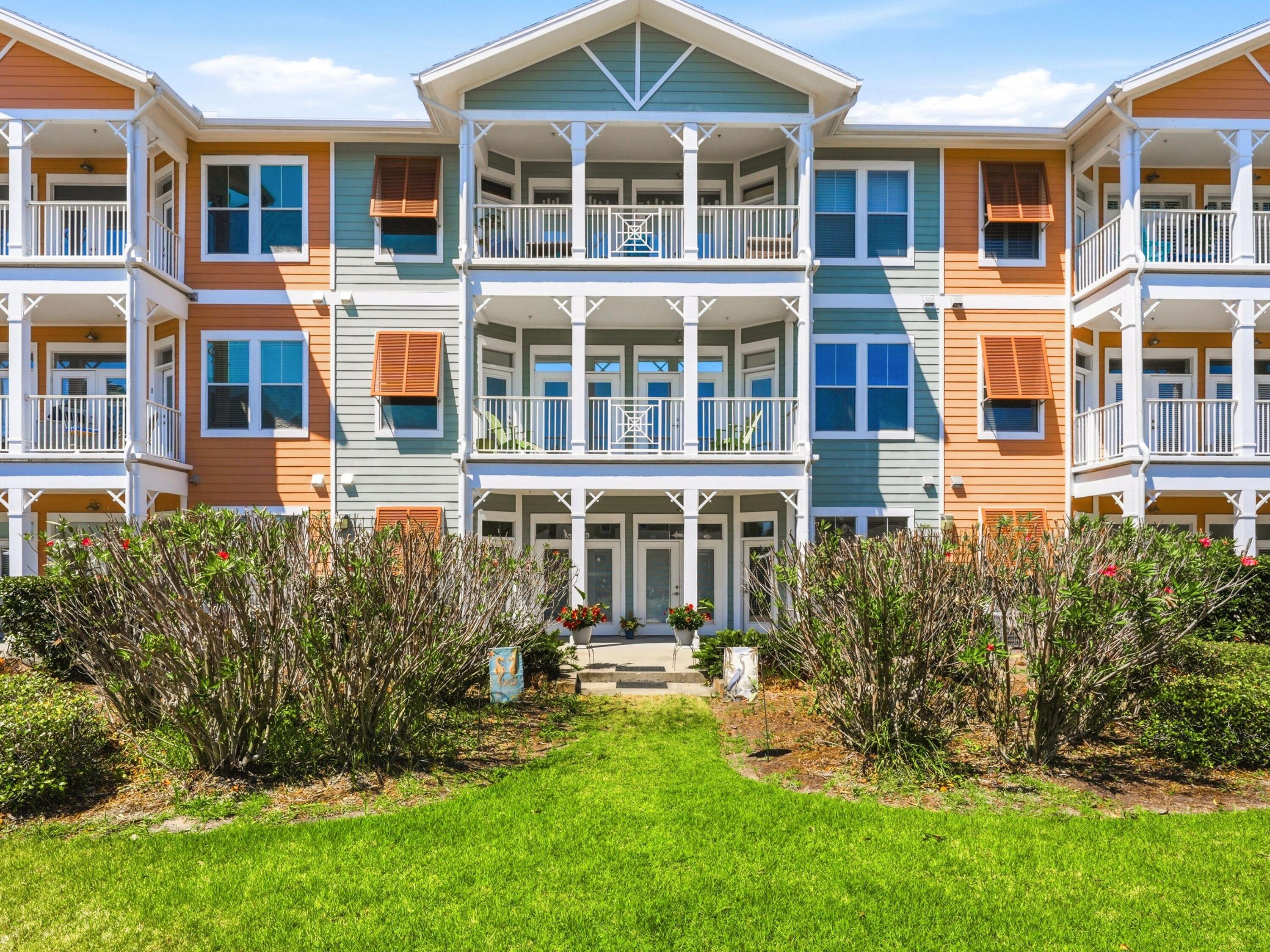 Set within the gated grounds of Island Reserve, this first-floor residence offers an easygoing take on coastal living with the kind of convenience that is hard to overstate. Positioned just off the parking garage, the condo makes everyday arrivals refreshingly simple, whether unloading groceries, bringing in beach gear or pulling up just outside the patio from the interior road. Inside, 10-foot ceilings, crown molding and a thoughtful split-bedroom layout give the home an airy, comfortable feel suited to both entertaining and quiet retreat.

The kitchen is designed for gathering, featuring stainless steel appliances, undercabinet lighting, abundant cabinetry and a generous island bar that anchors the main living space. Recent updates add further appeal, including HVAC replacement in November 2024, a water heater installed two years ago, newer vinyl plank flooring throughout with no carpet, fresh paint and updated vents and light bulbs throughout. Additional recent improvements include a new toilet in the primary bath, professional shower recaulking and cleaning, regrouted kitchen flooring and a deep cleaning that extended to blinds and baseboards.

Both bedroom suites offer walk-in closets and direct patio access, creating a rare sense of privacy and connection to the outdoors. One bath includes a soaking tub and separate shower, while the second features a standalone shower. The spacious patio is framed by a colorful mix of shrubs and flowers, offering a more secluded setting for relaxing or sunbathing.

Building 7 enjoys a particularly convenient location next to the amenities building and just moments from the community's lagoon-style pool, complete with waterfalls, a hot tub and splash pad. Owners also enjoy access to a modern fitness center, pickleball and basketball court, theater room, pool table and community gathering spaces, along with beautifully landscaped courtyards accented by lighted fountains. HOA dues include pest control and yard maintenance, adding to the ease of ownership. Less than two miles from the beach and close to restaurants, shopping and medical facilities, this golf cart-friendly residence also benefits from a lively social calendar and the added advantage of no short-term rentals. Move in, relax and enjoy.