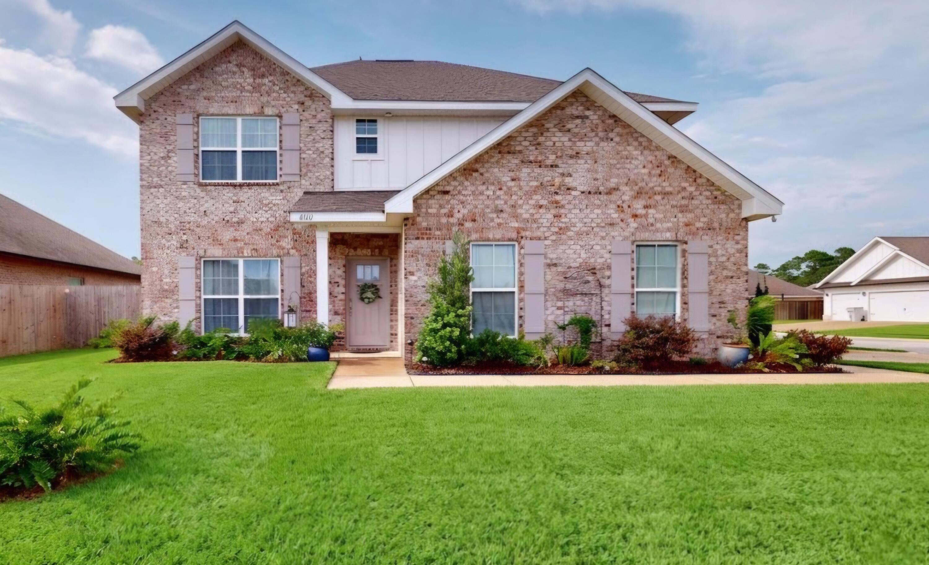 Welcome home to 4602 Phoenix Palm Dr in Gulf Breeze, FL! This beautiful 4-bedroom, 2.5-bath Craftsman style brick home is set on a large corner lot with a privacy fence--offering space, comfort, and a little extra seclusion when you want it most. Located in Nature's Cove, a beautiful neighborhood great for families just off Soundside Drive. This lovely, well thought out home features soaring 9.5 ft ceilings with 6 inch crown throughout the downstairs, where the Primary Suite, Laundry room, Kitchen, Living Room, Dining Room, and Guest 1/2 Bath are located. The flooring downstairs consists of  wood-look porcelain plank tile, offering the timelessness of wood with the durability of tile. The kitchen has brand new white subway tile backsplash installed and stainless vent hood to match all stainless appliances. The smart-capable gas stove and oven are perfect for the at home chef.  Natural stone is the highlight of the kitchen with plenty of countertop space to prep and serve at the oversized kitchen island. Upstairs you'll find 3 additional spacious bedrooms, a full bathroom, and the versatile, large family room/media room. Everyone is sure to have plenty of room! Enjoy outdoor living on the covered porch with room to spread out, then head out for a relaxing day by the water as you're within walking distance to Soundside Park and the Santa Rosa Sound. A great location, a fantastic yard, and plenty of space to live--don't miss your chance to call this one home!