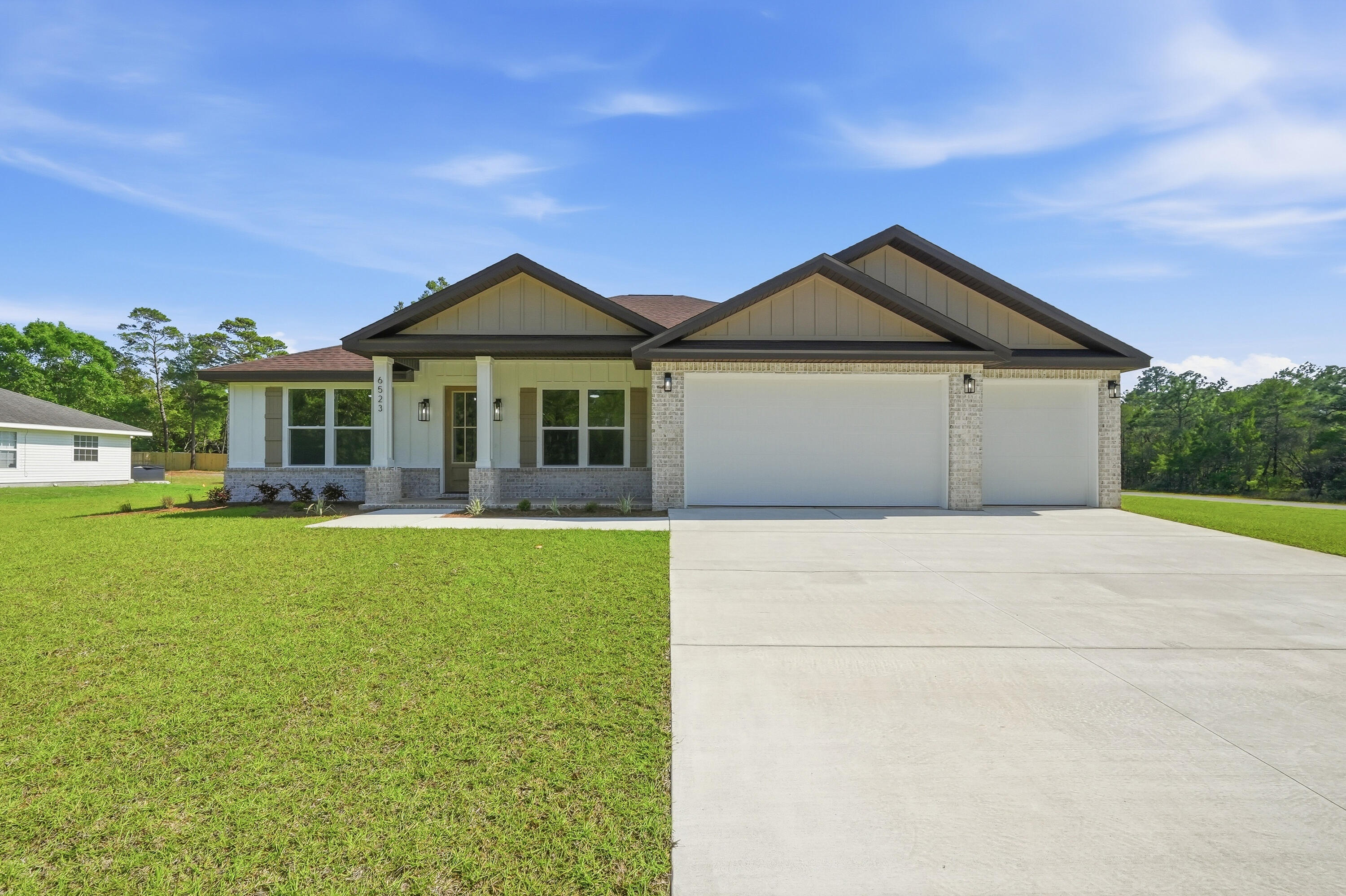 Fall in LOVE with this NEW Craftsman style home in sought after, Holley-By-The-Sea! ENJOY the many AMMENITIES this community has to OFFER! Located on a desirable OVERSIZED PRIVATE CORNER lot (NO wetlands) with plenty of room to create the backyard space of your dreams with a future POOL, WORKSHOP and store your RV/BOAT with easy side yard access! 5-bedrooms, 3-bathrooms, & a HUGE 3-car garage PLUS all of the CUSTOM home upgrades that you have been looking for: BRICK exterior with 2X6 construction, TALL ceilings, 8' entry door, OVERSIZED 6' front windows, and a rear covered PATIO with a ceiling fan and recessed lighting. Inside boasts durable LVT flooring (no carpet), custom all-wood CEILING height cabinetry w/ soft-close hinges, WOOD HOOD vent cabinet w/ blower, tile backsplash, large kitchen ISLAND w/ double sided cabinetry, QUARTZ counters, MICROWAVE DRAWER, slide-in range, walk-in pantry, MUDROOM, and a laundry room with added FREEZER space. 
Other features include: recessed lighting throughout interior and exterior, coat closet, trey ceilings in living room and master bedroom, ceilings fans in all bedrooms and on back patio, jack and jill bathroom with double vanity and private water closet, 3rd full bathroom with back patio access, oversized closets with lighting, 2 walk-in closets in master suite, tiled walk-in shower with glass doors, private water closet, double vanity, linen closet, floating shelving, and an oversized window. Ask about Builder provided incentives!