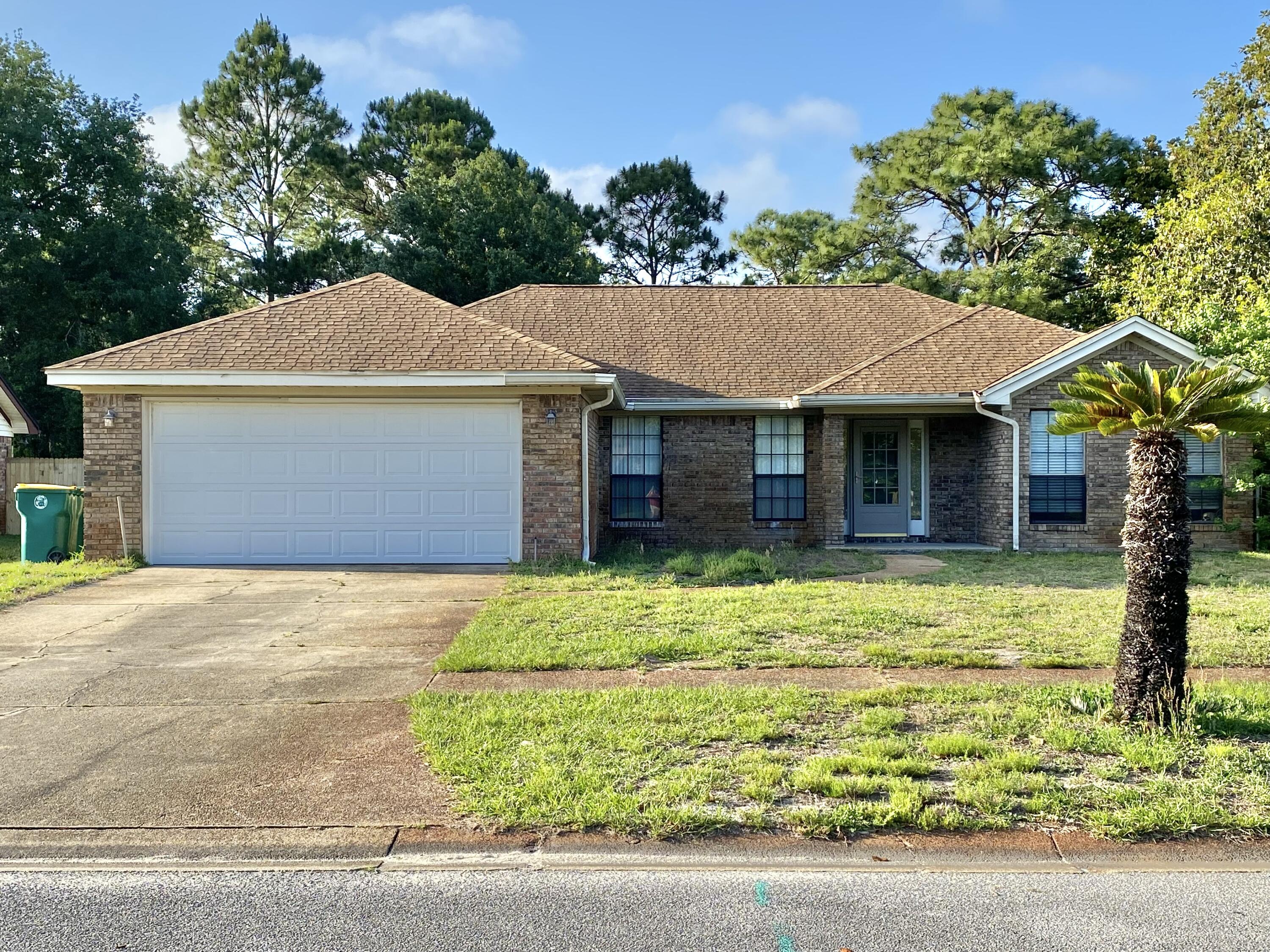 HAD A FULL INSPECTION DONE AND SELLER HAS AGREED TO REPLACE THE ROOF AND CLEAR THE 4-POINT AND WIND MITIGATION SO INSURANCE WILL BE IN LINE! Welcome home! This lovely brick home is close to Hurlburt Field A.F.B., beaches, shopping, and more. Enjoy your quiet retreat at this home that backs up to the base reservation while sitting in your own cooled Florida room. This well-maintained home features a kitchen island with a breakfast bar for getting ready for your day or just relaxing with friends. Freshly painted! Enjoy the fireplace, the spacious bedrooms, skylight, new fixtures, fully fenced backyard, and more. Ready for you to move in now! Buyer and Buyers agent to verify all dimensions and anything deemed important.