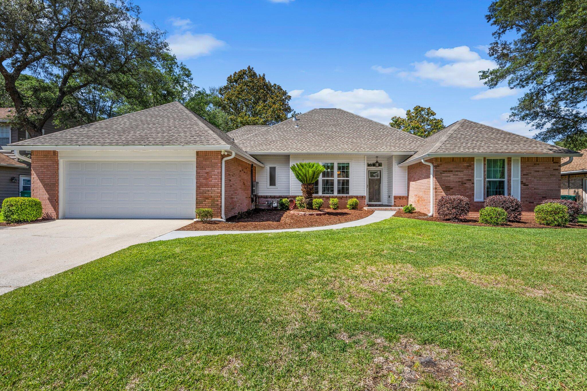 Welcome to this spacious 4-bedroom, 2.5-bath home located in the highly desirable Bluewater Bay community! Designed for both comfort and entertaining, this home features a large fenced backyard complete with a sparkling swimming pool -- perfect for enjoying Florida's warm weather year-round.

Inside, the kitchen is equipped with stainless steel appliances and kitchen island that opens to inviting living spaces accented by stylish LVP and tile flooring throughout. The large temperature controlled Florida room provides versatile additional living space, ideal for a home office, game room, or relaxing retreat.

Updated bathrooms add a modern touch, while the functional floor plan offers plenty of room for everyday living. Conveniently located near top-rated schools, military bases, shopping, dining, and local amenities, this home combines comfort, style, and an unbeatable location. Don't miss your opportunity to make this Bluewater Bay gem your next home! Contact us today for a showing!