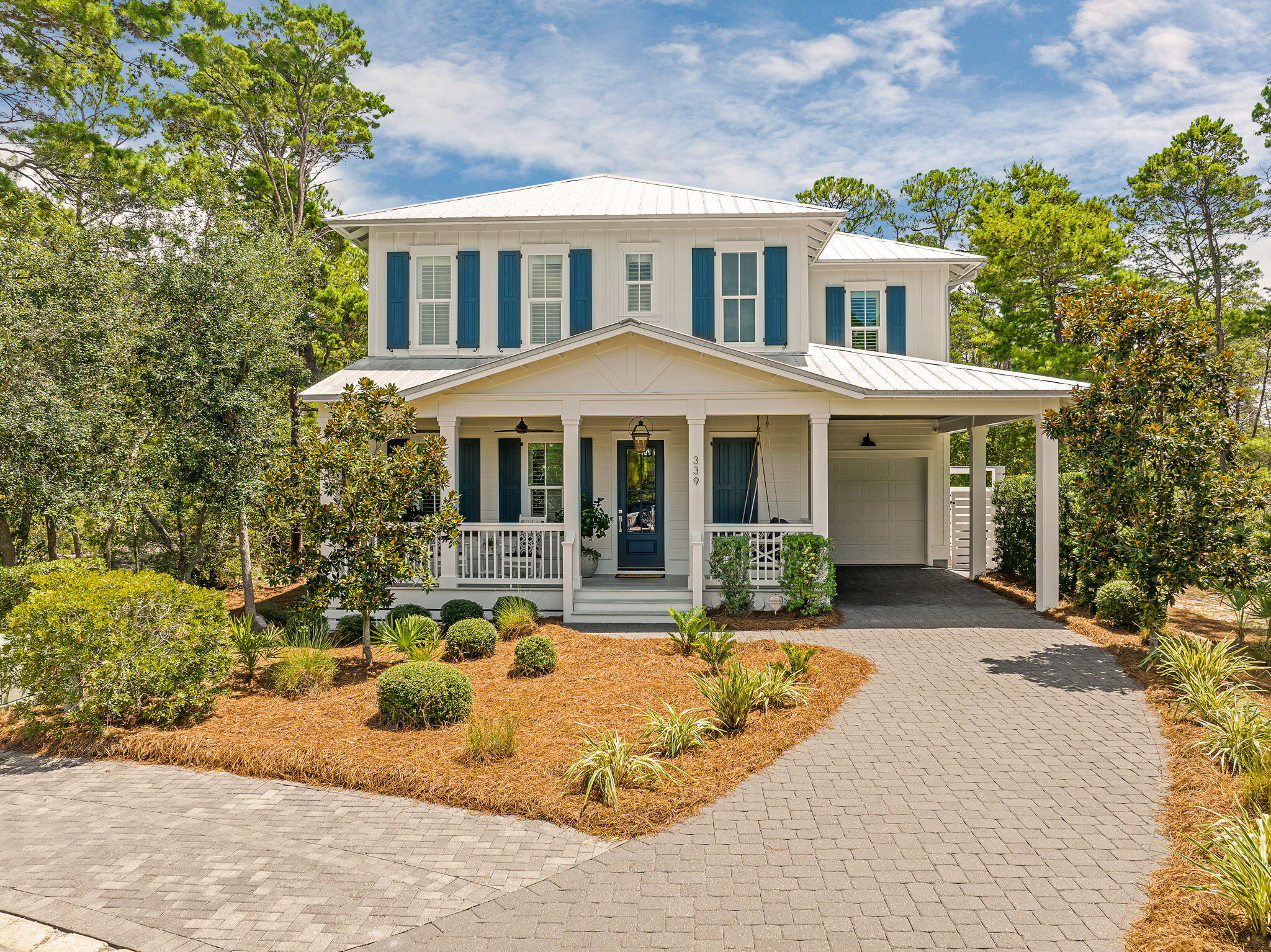 Welcome to 339 Matt's Way! Experience coastal sophistication in this custom-designed retreat, perfectly positioned behind the gates of Lakeside at Blue Mountain. Backing directly onto the serene expanse of Grayton Beach State Park, this turn-key, fully furnished residence offers a rare blend of modern luxury and natural seclusion.

The main level is anchored by a chef's kitchen that serves as the heart of the home, featuring a gas range, professional hood, and double ovens. The open-concept living area flows effortlessly onto a screened porch, which leads to an outdoor oasis complete with a firepit, Big Green Egg, and grill--ideal for evenings spent under the stars. A thoughtfully placed first-floor guest suite provides convenience and privacy for visitors.

The second floor is a dedicated sanctuary, headlined by a primary suite that overlooks the forest. The spa-like ensuite features a soaking tub and a three-head shower, along with a private porch for quiet morning coffee. Adjacent to the primary, a double-insulated flex room offers the versatility to become a home office, bunk room or additional living space. Two more bedrooms and full bathrooms complete the upper level, ensuring plenty of space for everyone. The pull down stairs to full attic is added storage space for new home owner. 

Practicality meets comfort with an insulated garage designed to optimize energy efficiency and climate control. Beyond the home, the lifestyle of Blue Mountain Beach awaits. You are moments from the iconic scenery of 30A, the rare coastal dune waters of Redfish Lake, and multiple public beach access points. A community path provides easy access to local favorites like Blue Mountain Creamery and Cowgirl Kitchen. The home backs up to Grayton Beach State Park that encompassing over 2,000 acres of coastal sanctuary providing privacy and amazing bird watching. 

Adding even more value, a brand-new community pool with a modern, expanded design is slated for construction this fall, and the assessment has already been paid in full. Whether you are seeking a full-time residence, a high-end vacation rental, or a peaceful second home, this property delivers the ultimate 30A experience.