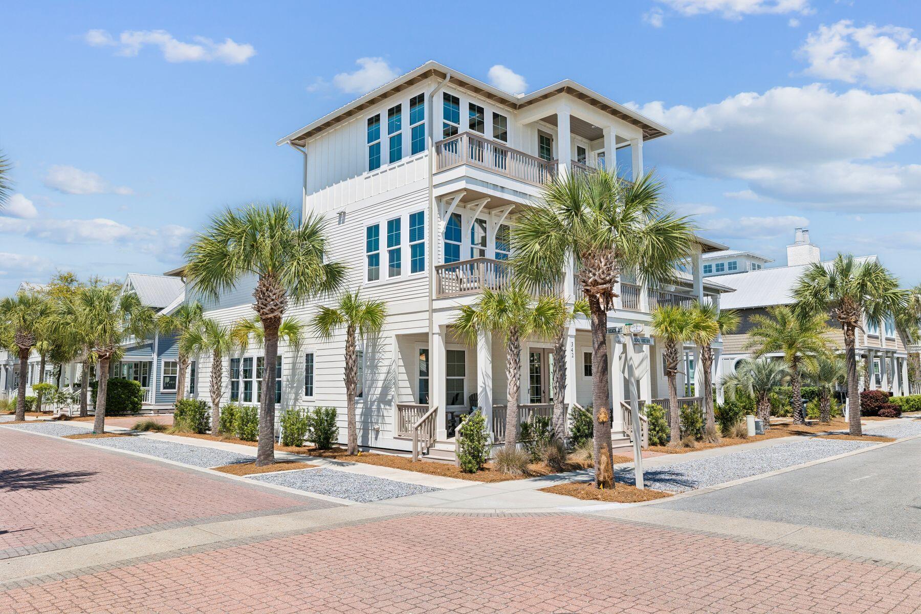 Welcome to 342 Beach Bike Way, a truly exceptional offering in the heart of Seacrest Beach along Scenic Highway 30A. Built in 2023 and meticulously maintained as a second home, this fully furnished residence represents a rare opportunity to own one of the largest and most thoughtfully designed homes in the community. Positioned on a sprawling corner lot, this property offers a level of space, privacy, and flexibility that is seldom found in Seacrest Beach. The main home spans three stories, with a dedicated living area on each level, allowing the home to comfortably live and sleep far beyond its four-bedroom designation. Every bedroom features its own ensuite bathroom, including two true primary suites, one conveniently located on the first floor and another privately situated on the second. The first floor is designed for effortless living and entertaining, featuring expansive open-concept spaces anchored by a fireplace and framed by beamed ceilings and abundant natural light. A spacious kitchen with a large center island, gas range, walk-in pantry, and newly added coffee bar flows seamlessly into the dining and living areas. A wet bar, laundry room, and powder bath add convenience, while the first-floor primary suite offers direct porch access and a beautifully appointed ensuite with dual vanities, a walk-in closet, and a floor-to-ceiling tiled shower. Outdoor living is equally impressive, with a covered porch, gas grill, and a seamless transition to the private heated saltwater pool. 

The second level offers a generous secondary living space along with the second primary suite, complete with dual porches and a luxurious ensuite featuring dual vanities and a walk-in shower with dual shower heads. This level also includes a large screened-in porch with a television and swing daybed, creating an inviting outdoor retreat. Two additional guest suites, one featuring custom-built twin-over-queen bunks, each offer their own private ensuite bathrooms, ensuring comfort and privacy for all. The third floor provides incredible flexibility, currently serving as an office and additional living area, but easily adaptable into a bunk room or entertainment space to further enhance rental potential. This level also includes a wet bar, bathroom, and private porch. 

A standout feature of the property is the detached carriage house, currently a blank canvas ready to be transformed into a game room, fitness space, office or additional lounge area ideal for creating a unique entertainment zone. Additional highlights include a one-car garage equipped with an electric vehicle charging station, ample dedicated driveway space and surrounding street parking. Privacy film has been installed on all windows, allowing for abundant natural light while enhancing privacy, reducing UV exposure, and improving energy efficiency. Other notable updates include a fully rebuilt second-floor primary bathroom, screened-in porch addition, saltwater pool conversion, water purification and softening system, new gutters and upgraded indoor and outdoor furnishings. Offered fully furnished and in pristine condition, this home combines size, quality, and versatility. 

Located within Seacrest Beach, owners enjoy access to a 12,000 square-foot lagoon-style pool, private beach access, and Peddlers Pavilion. The home is also just a short walk or bike ride to the shops and dining of Rosemary Beach and Alys Beach, placing the very best of 30A at your doorstep.