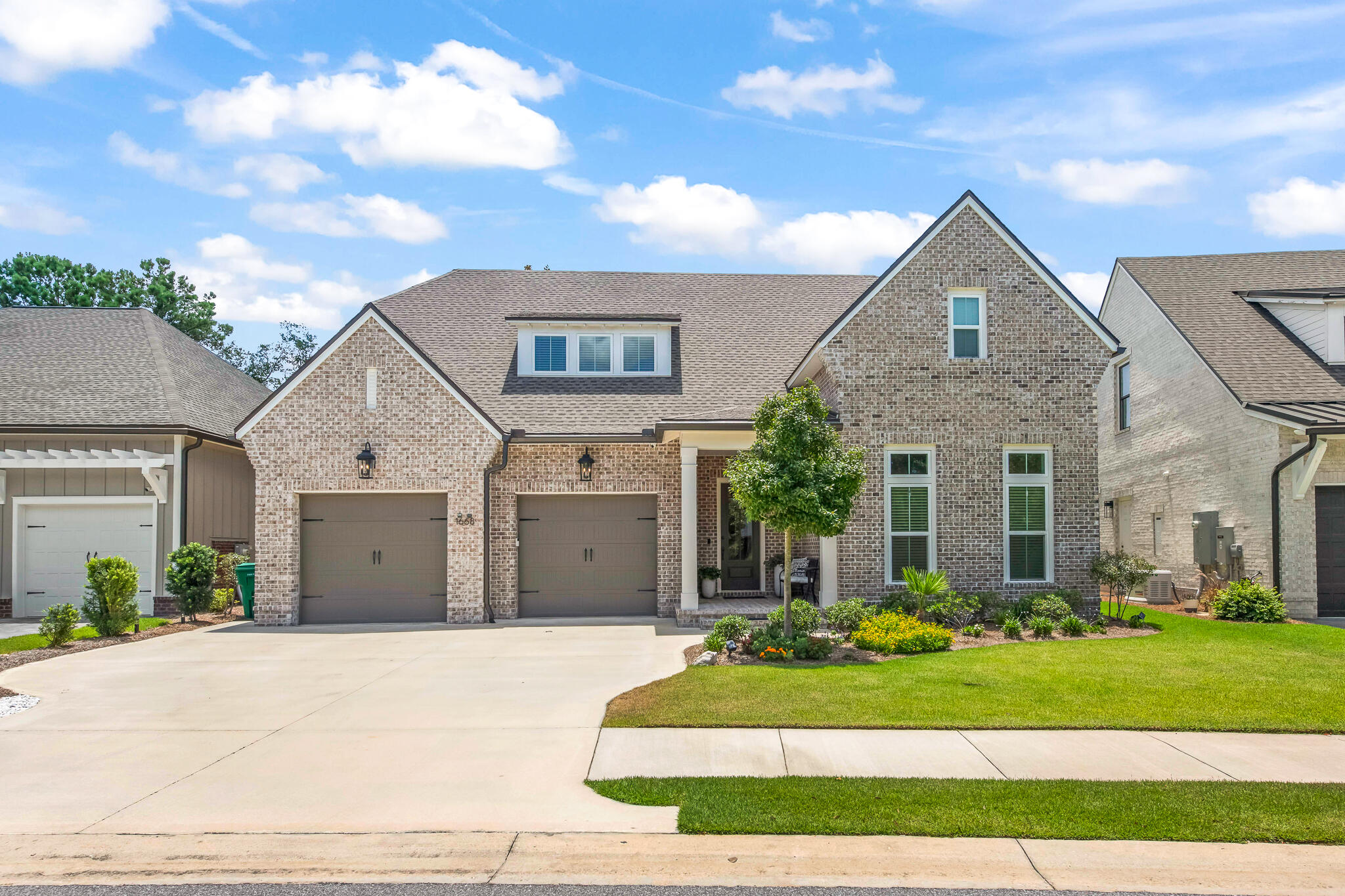 Priced to sell and backed by a recent professional appraisal, 1668 Ella Lane presents an exceptional opportunity to own a beautifully crafted home at a price that reflects today's market. Located in the desirable Fate's Landing community of Bluewater Bay, this thoughtfully designed residence was built by renowned local builder Randy Wise Homes and offers 3,807 square feet, spacious first-floor living, and quality craftsmanship throughout. The well-appointed floor plan effortlessly blends everyday comfort with elegant entertaining, while a welcoming foyer with custom built-in shelving sets the tone for the inviting open-concept living spaces beyond.  The living room serves as the heart of the home, anchored by a striking focal wall featuring a gas fireplace with a brick surround, custom built-in cabinetry, and ample space for gathering with family and friends. Designed with both function and hospitality in mind, the chef's kitchen offers exceptional flow and versatility. Features include a gas range, built-in wall oven and microwave, granite countertops, a counter-height breakfast bar, and abundant prep space. Thoughtful additions such as a wine and beverage cooler and a butler's pantry enhance the entertaining experience while preserving the home's open and connected feel. The first-floor primary suite provides a private retreat, complete with separate his-and-her walk-in closets and a spacious ensuite bath featuring a double vanity and generous storage. Also located on the main level are two additional bedrooms connected by a Jack-and-Jill bathroom, a dedicated home office, a spacious laundry room, and a convenient powder bath for guests. Upstairs, a second living area creates the perfect gathering space for family and guests while providing separation and privacy between two additional bedrooms, each featuring its own en-suite bathroom. A bonus room offers flexibility as a second home office, hobby room, fitness space, or media room to suit your lifestyle. Thoughtfully designed for storage, the walk-in attic has been finished into an expansive storage area, providing ample room for holiday décor, seasonal items, and everything you want tucked away but easily accessible.  

Additional features include a two-car garage with built-in storage systems, Electric Car Charging System, as well as a whole home Generac Generator. The expansive back patio provides a seamless extension of the living space complete with outdoor kitchen and offers ample room for the addition of a future pool. 

Nestled on a quiet street of just 21 homes, Fate's Landing is tucked just off Bay Drive and follows the gentle curve of a former golf fairway, creating a peaceful setting surrounded by nature. Every home backs to a protected wetlands conservation area, offering privacy and beautiful natural views, while a community park awaits at the end of the cul-de-sac.