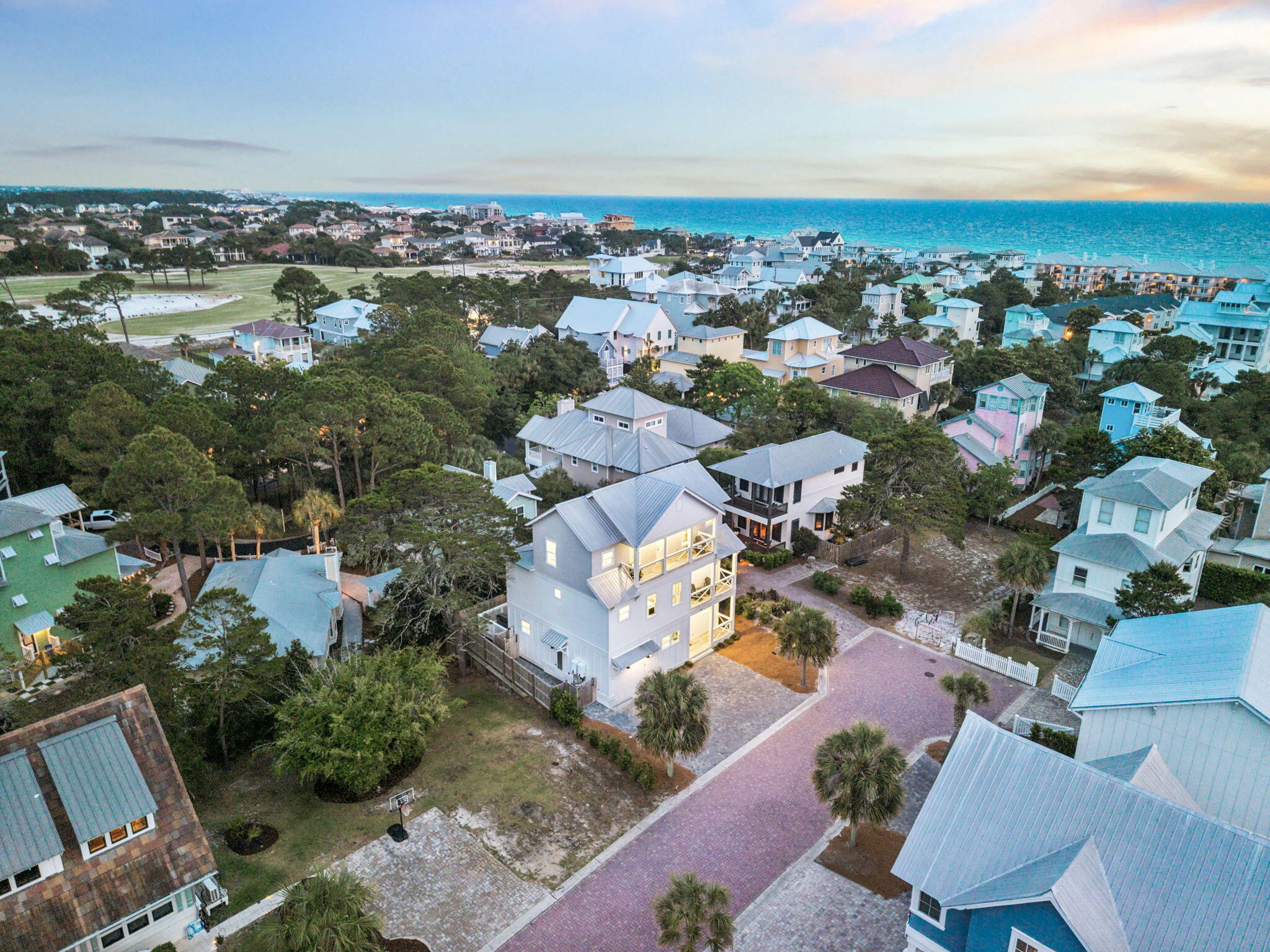 Built in 2023 and tucked inside Sea Pointe, a private enclave of just nine homesites in Dune Allen Beach, this 5-bedroom, 4.5-bath home sits steps from the Gulf with horizon views of the water and the kind of quiet that defines the western stretch of 30A.
The open-concept main level is built for the way people actually use a beach house. The kitchen anchors the main level with a 6-burner gas cooktop, GE Cafe refrigerator, stainless steel appliances, tile backsplash, and a large walk-in pantry with ample cabinet storage throughout. The living room and laundry room flow together, opening directly to outdoor living space with a built-in BBQ and an outdoor shower. A one-car garage and generous parking make arriving and unloading effortless. Upstairs, two outdoor porches and multiple balconies extend the living space outward, with shiplap walls, coastal finishes, a wet bar with wine chiller, and horizon Gulf views from multiple levels. Dual gas tankless water heaters ensure the home runs efficiently year-round.
The community pool sits directly across the street. Three public beach access points, Lake Causeway, Palms of Dune Allen West, and Palms of Dune Allen East, give owners and guests easy options for getting to the sand.
Dune Allen is one of the most unspoiled stretches along 30A. Topsail Hill Preserve State Park, Point Washington State Forest, Eden Gardens State Park, and the Timpoochee Trail are all within easy reach for hiking, biking, and exploring 30A's rare coastal dune  lakes. Shunk Gulley, Vue, and Stinky's Fish Camp are the local favorites for waterfront dining. The pace here is slower by design, it's the part of 30A people come back to when they want to actually unplug. Whether you're looking for a turnkey investment property, a second home, or a primary residence with real rental upside, 33 Maritime Way checks every box.