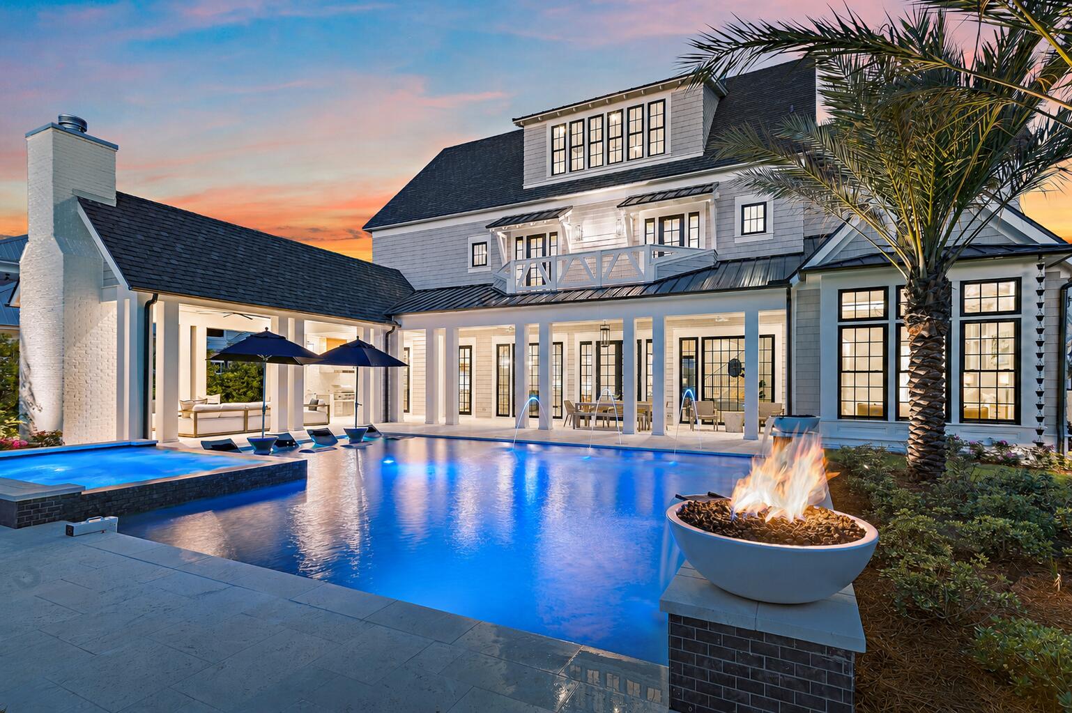 At 107 Quail Hollow Court in WaterSound Camp Creek, the experience begins outdoors. Set within one of the most amenity-rich luxury communities near Scenic Highway 30A in Inlet Beach, Florida, this substantial coastal residence is distinguished by an unusually generous backyard, resort-style pool environment, and nearly 8,000 square feet of living space designed for gathering at scale. A heated saltwater pool framed by fire bowls anchors the outdoor setting, while a full outdoor kitchen, fireplace, and expansive lawn create a private environment for entertaining, recreation, and unhurried days along the Northwest Florida Gulf Coast.

The scale of the outdoor living is particularly compelling. Beyond the pool terrace, the yard opens into a broad stretch of green space that gives the property a sense of breathing room rarely associated with resort-community living. There is room for a full house without the home ever feeling crowded, whether the day calls for children on the lawn, dinner beside the pool, a game-day gathering outdoors, or a quiet morning before the rest of the house wakes. Here, outdoor living is not an amenity added to the home. It is central to the way the property lives.
 Inside, 7,950 square feet across three levels allows that same sense of generosity to continue. Six bedrooms, seven full baths, three half baths, and a three-car garage support both everyday living and extended stays with family and guests. Warm hardwood floors, coffered ceilings, custom millwork, and thoughtfully proportioned rooms lend architectural character without sacrificing comfort. The interiors feel polished, but never overly formal, creating the kind of ease that matters in a second home, full-time residence, or multigenerational coastal retreat.

The kitchen sits naturally at the center of the home and is designed for entertaining without allowing the work of entertaining to dominate the room. Custom cabinetry and Sub-Zero appliances establish the primary kitchen, while a generous walk-in pantry and dedicated scullery provide valuable secondary prep and storage space. A curated wine cellar adds another layer to the home's entertaining capabilities, and the adjacent living area, grounded by a fireplace and custom built-ins, offers a comfortable gathering place with a direct relationship to the outdoor living beyond.

Private and recreational spaces are distributed across the upper levels, giving owners and guests room to settle into different rhythms. A game room or bunk room provides flexibility for younger guests, recreation, or overflow sleeping, while the third-floor movie room with wet bar creates a separate destination for film nights, sporting events, and relaxed evenings at home. The result is a residence that accommodates large gatherings while still offering distinct places for retreat.

Ownership at 107 Quail Hollow Court also places the home within the broader WaterSound Camp Creek lifestyle near 30A, Camp Creek Golf Course, and the Gulf of Mexico. WaterSound Camp Creek property ownership carries a mandatory WaterSound Club membership, subject to application, approval, dues, fees, and applicable membership terms. Available membership levels can provide access to WaterSound Beach Club amenities as well as Camp Creek pools, wellness facilities, racquet amenities, dining, and, depending on membership level, golf privileges.

For buyers searching for a luxury home in WaterSound Camp Creek, a substantial residence near 30A with a private heated saltwater pool, exceptional outdoor entertaining space, multiple recreation areas, and access to the WaterSound Club lifestyle, 107 Quail Hollow Court offers a compelling combination of scale, privacy, and livability. It is a home designed not simply around how much space it contains, but around how well that space allows people to gather, retreat, entertain, and experience life on the Northwest Florida Gulf Coast.