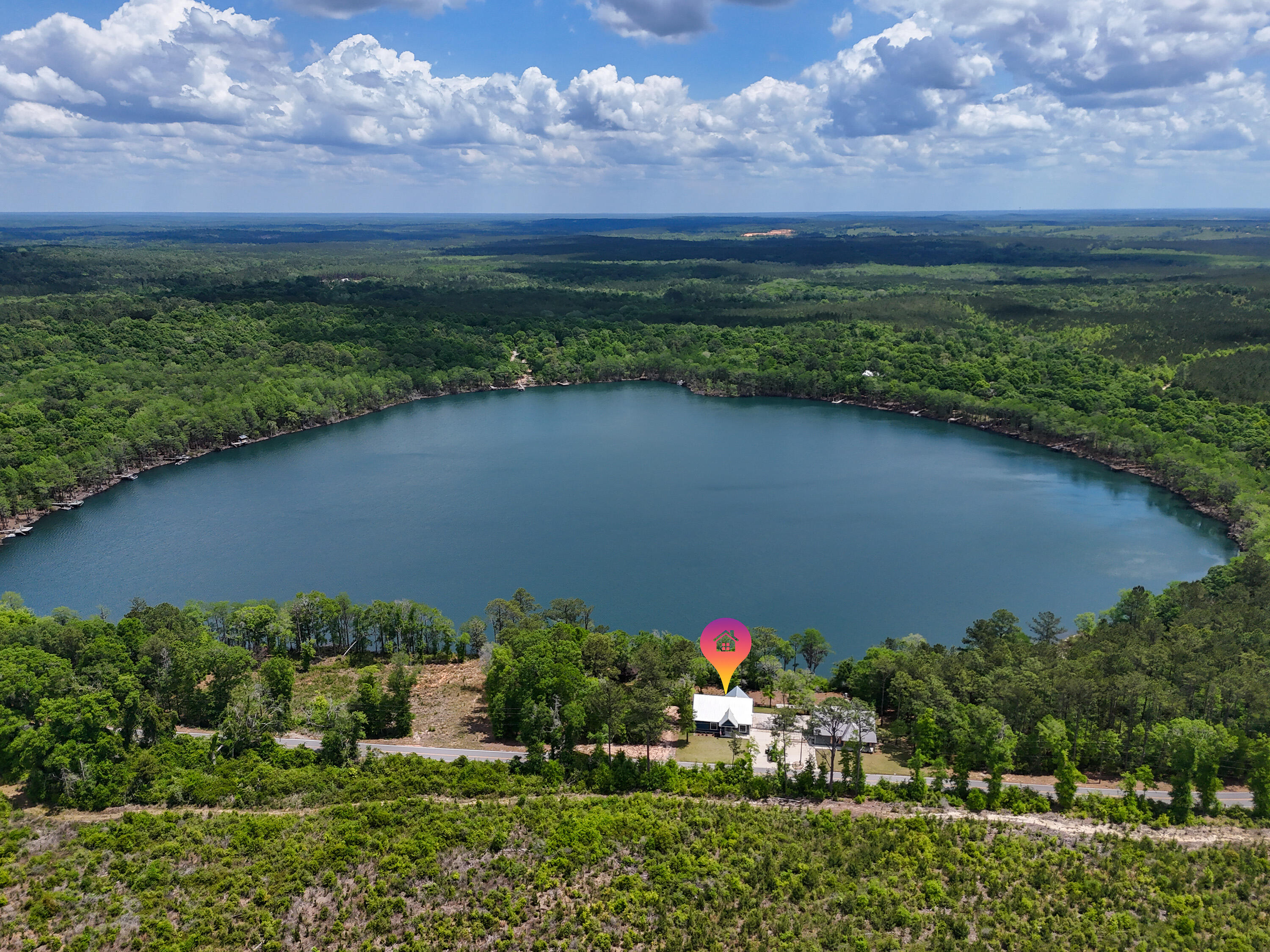 182 Blue Pond Rd is one of those homes that's better experienced than explained.

It sits on Blue Pond in a quiet part of Ponce de Leon, with water views, privacy, and none of the traffic or density you're dealing with closer to the coast. You're still within reach of Freeport and South Walton, but when you're here, it feels removed in a good way.

The home was built in 2023 and leans more custom than spec. The main level is open and straightforward, kitchen, living, and dining all facing the water with access to a large deck. Quartz countertops, café appliances, good storage, nothing overdone, just done right.

What really separates it is the lower level. It's fully finished and functions as its own space with a second kitchen, wet bar, living area, and room for guests to spread out. It works well for extended family, visiting friends, or anyone who wants a little separation without giving up comfort.

The home is being sold furnished and has been professionally put together, so you're not starting from scratch.

At $799,000, it's positioned well for what you're getting, especially for newer construction on the water.

This could work as a full-time home, but it also makes a lot of sense for someone in South Walton or Freeport looking for a second place that's easy to get to and actually feels like a break from the pace out there.
