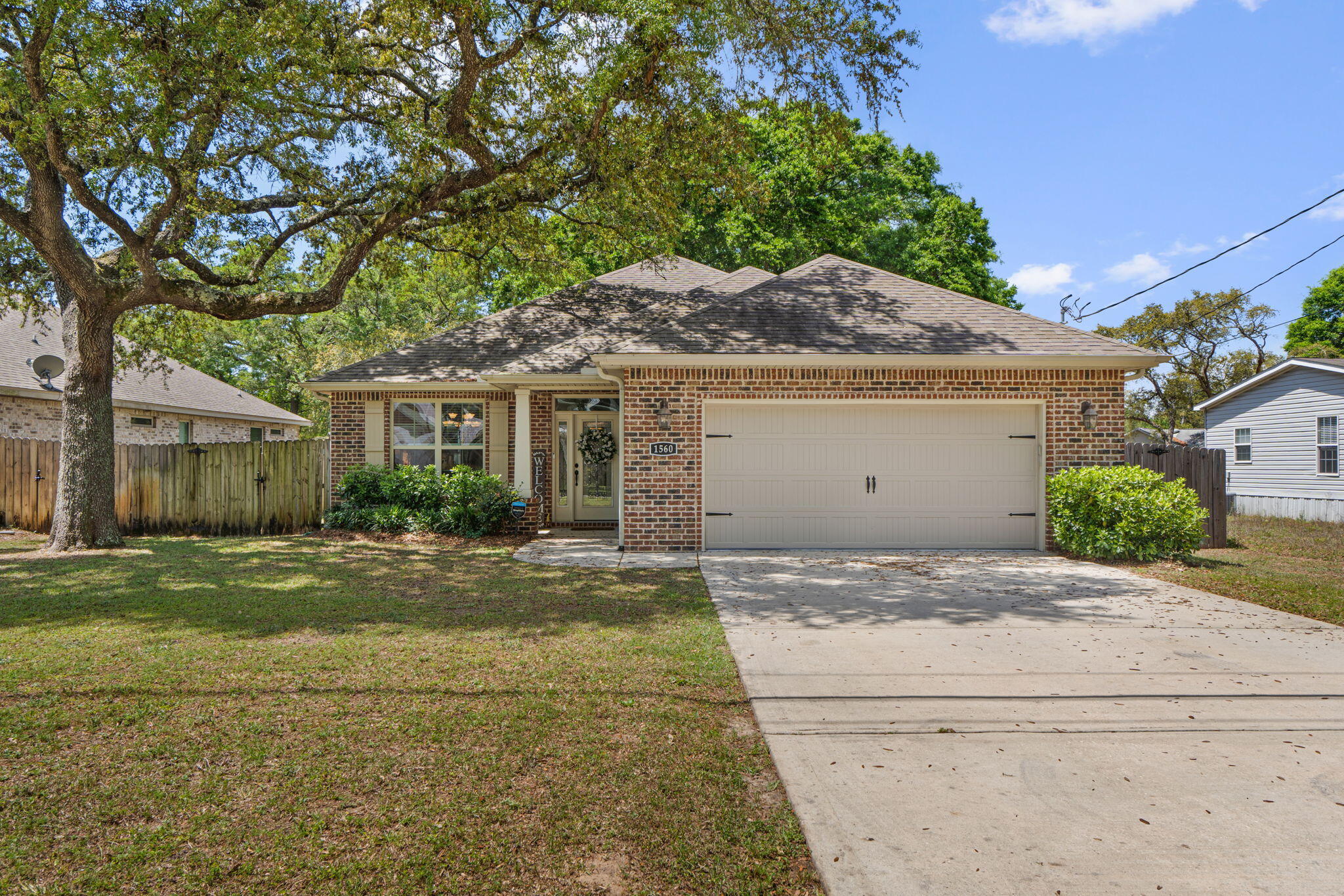 Step into modern luxury with this stunning 2019-built residence, perfectly positioned in the heart of Niceville! NO HOA here! This isn't just a house; it's an entertainer's dream, boasting an expansive split floor
plan with four spacious bedrooms and 2.5 baths. From the moment you walk in, you'll be captivated by the high ceilings, elegant crown molding, and gorgeous wood-look tile floors that flow seamlessly through all the main living areas and bathrooms. The chef-inspired kitchen is a true showstopper, featuring sleek granite countertops, a massive breakfast bar, and a walk-in pantry. These premium granite surfaces carry through to all the bathrooms, adding a touch of sophisticated cohesion throughout the home. Retreat to the lavish primary suite--privately tucked away from the guest rooms--featuring trey ceilings and a spa-like ensuite bath where you can soak away the day in the garden tub. The excitement continues outside on your impressive 0.31-acre lot! The excitement continues as you head out to your fully screened-in back porch--the ultimate spot for morning coffee or bug-free evening relaxation! Beyond the porch, the sprawling, level backyard is fully wrapped in a privacy fence for your own personal oasis. There is plenty of room to add a pool.  Modern peace of mind comes standard here, with hurricane shutters, energy-efficient double-pane windows, and a lawn maintained by a dedicated irrigation pump. Located just minutes from the pristine trails of Rocky Bayou State Park, easy access to Mid Bay bridge, this home offers the ultimate Florida lifestyle. Don't wait--this contemporary gem is ready for its next chapter!