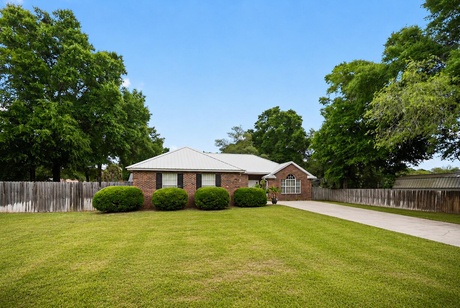 Secure your South Crestview sanctuary where convenience and durability meets well established and family vibes. Experience the peak of Florida living in this impeccably updated retreat. A new kitchen with sleek granite counters and a gas range turns every meal into a celebration. Total peace of mind is yours with a 2025 metal roof, 2020 HVAC, and a whole house generator, ensuring years of worry-free comfort. The backyard features a dedicated RV gate, perfect for securing your weekend toys in a private, quiet oasis. Located in a walkable, established neighborhood with mature trees, this home blends timeless charm with modern resilience. Opportunities in this coveted corridor at this price vanish instantly--claim your turnkey lifestyle before it's gone.