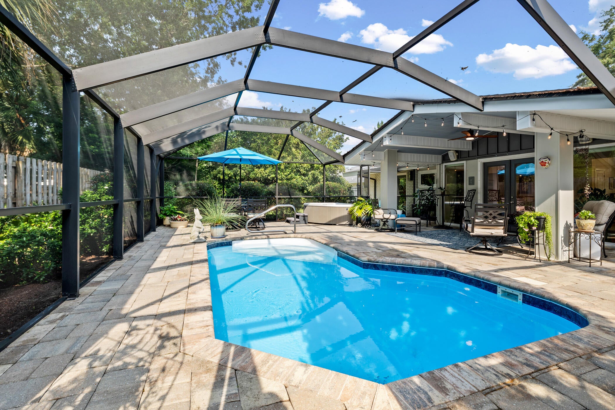 Nestled on a spacious corner lot just under a quarter acre in one of Pensacola's most sought-after neighborhoods, this exceptional property offers the perfect blend of charm, versatility, and convenience. Walking distance to the East Hill Wine Bar and other local dining, cafes, and parks. Located just five minutes from the Three Mile Bridge, which takes you to Pensacola Beach, and less than ten minutes from vibrant Downtown Pensacola. The property offers 4 bedrooms, 3 full bathrooms, and 1 half bath. The main residence features 3 bedrooms, 2 full bathrooms, and 1 half bath, thoughtfully designed for comfortable everyday living. Attached to the home is a beautifully finished private ADU, creating an incredible opportunity for multigenerational living, long-term guests, a home office, or rental potential. The ADU showcases a custom-designed kitchen, a washer and dryer, spacious bedroom, walk-in closet plus an additional bedroom closet, and a luxurious Jack-and-Jill style bathroom complete with dual vanities and an oversized double shower. Step outside into your own backyard retreat featuring a sparkling salt water pool, covered lanai, relaxing hot tub, lush landscaping with mature gardens, a covered outdoor seating area, green space for pets or play, and a convenient storage shed. A single-car garage and oversized driveway provide ample parking for residents and guests alike. With its prime location, attached ADU, generous outdoor living spaces, and timeless neighborhood appeal, this is a rare opportunity to own a truly versatile property in the heart of Pensacola!