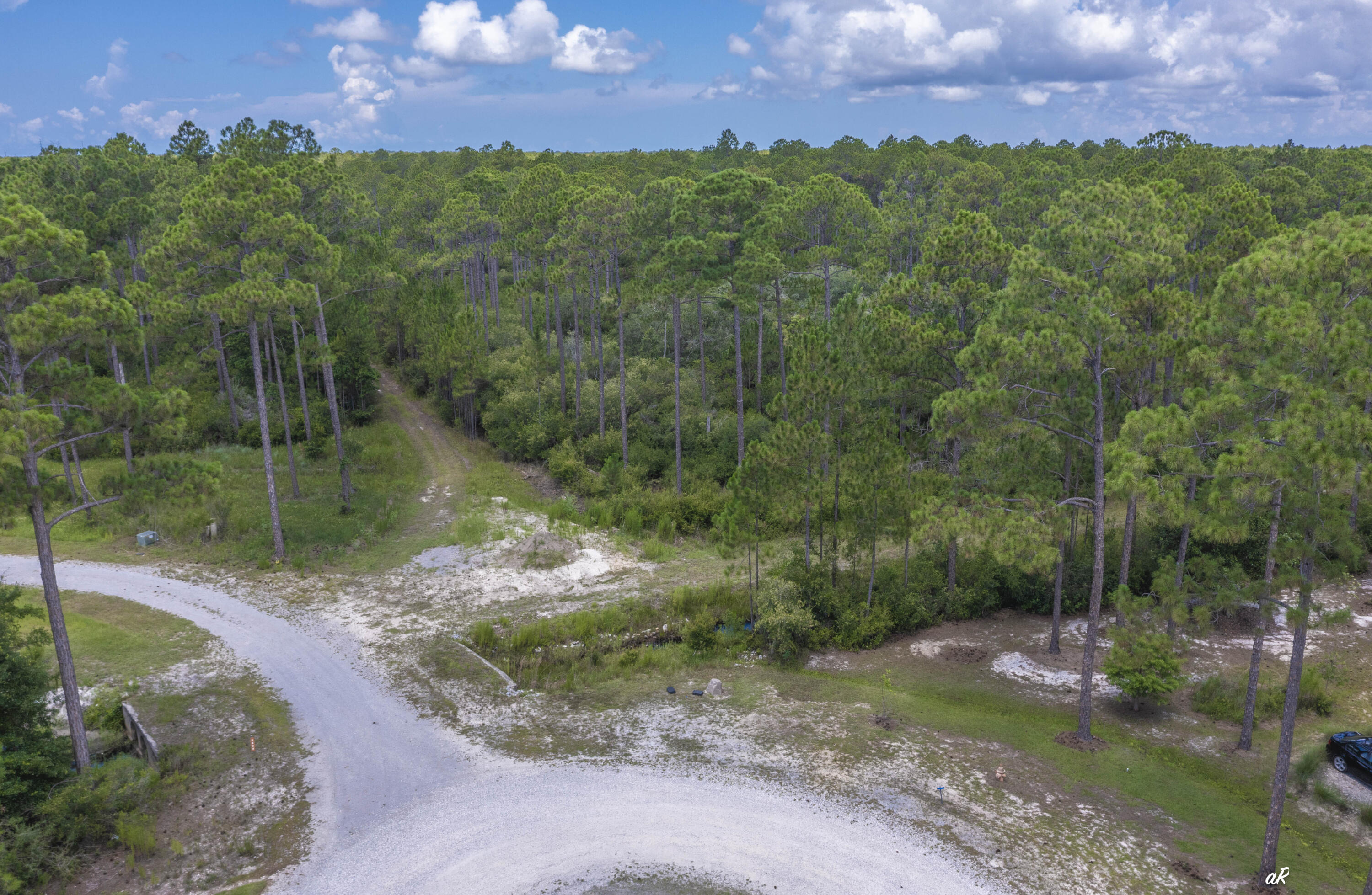 Build your dream home in RiverCamps on Crooked Creek, one of Panama City Beach's most desirable gated waterfront communities. Located at 6624 Button Buck Trail, this homesite offers the perfect setting for those seeking privacy, natural beauty, and a true coastal lifestyle. RiverCamps is a unique 1,500-acre community bordered by West Bay, Crooked Creek, and the Intracoastal Waterway, with the majority of the land preserved for conservation. Owners enjoy access to miles of trails and boardwalks, a community boat ramp, day-use boat slips, dry boat storage, a pool, pavilion, playground, and waterfront recreation areas. Whether you are looking to build a primary residence, second home, or coastal retreat, RiverCamps offers the rare combination of seclusion and convenience, just minutes from Northwest Florida Beaches International Airport, Pier Park, area shopping, dining, and the world-famous white sandy beaches of Panama City Beach. Call today to access the community and view this lot.