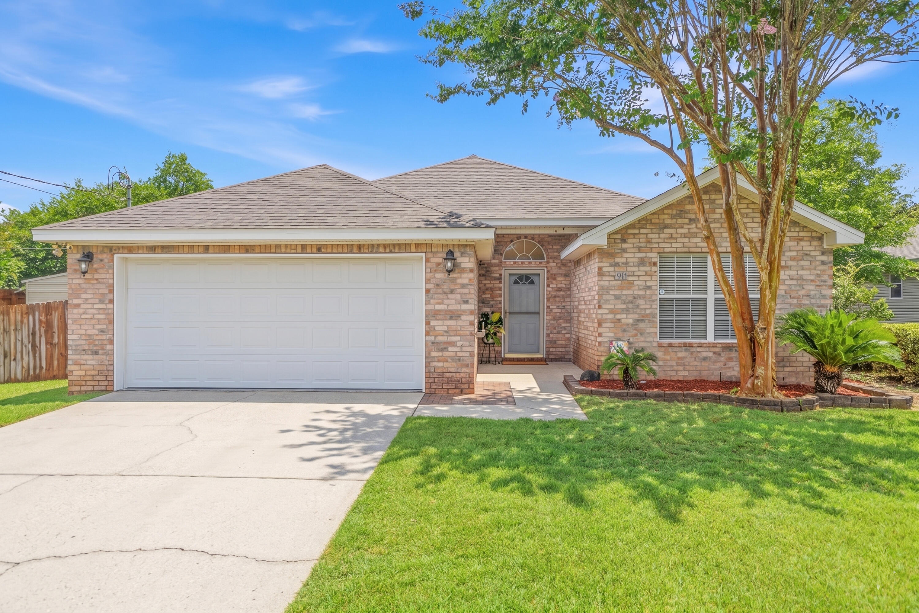 Move-in ready and just minutes from Hurlburt Field! Welcome to 98 Marimba Street, a beautifully maintained 3-bedroom, 2-bath home in Mary Esther offering the perfect combination of comfort, style, and convenience. This bright, open floor plan features soaring vaulted ceilings, fresh interior paint, and a spacious living area that flows seamlessly into the kitchen and dining space, creating an inviting layout for everyday living and entertaining.
The split-bedroom design provides privacy, while the oversized primary suite offers a peaceful retreat with a walk-in closet, dual vanities, and plenty of room to unwind. The kitchen overlooks the main living area, making it easy to stay connected while preparing meals or hosting family and friends.
Step outside to enjoy the large, newly fenced backyard complete with lush landscaping, mature trees, an updated deck, and a convenient vehicle gate. Whether you're entertaining, gardening, enjoying outdoor activities, or simply relaxing, this backyard offers exceptional flexibility and space.
Major updates provide added peace of mind, including a roof replaced in 2021, HVAC installed in 2024, and a new sliding glass door, allowing you to move in and enjoy your home with confidence. An attached two-car garage adds additional storage and everyday convenience.
Located in Mary Esther just minutes from Hurlburt Field, Eglin Air Force Base, shopping, dining, parks, public boat launches, and the Emerald Coast's white-sand beaches. This well-maintained home offers an outstanding opportunity for anyone looking for a move-in ready property in a highly convenient location. Don't miss your chance to make this beautiful home yours.