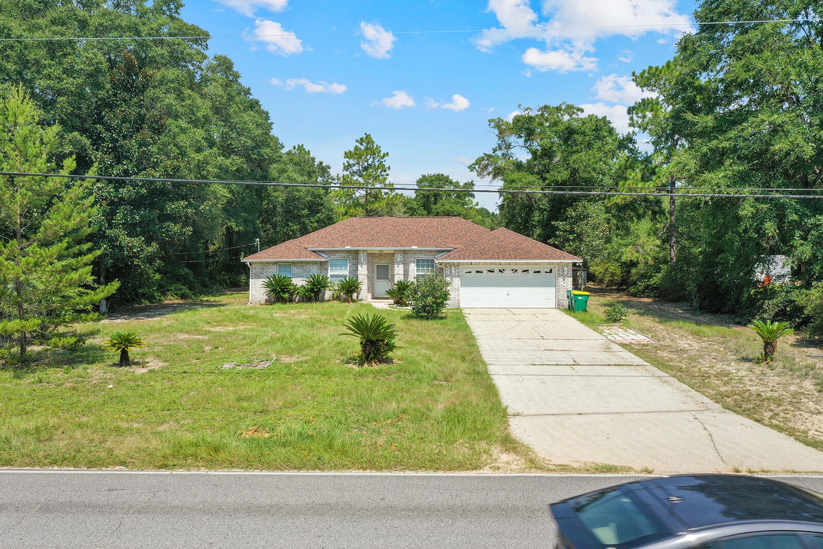 Brick, custom 2002 built home on .92 acres~ 3 bedrooms, 2 bathrooms, split floor plan, breakfast and formal dining room~ There is a propane fireplace in the living room with French Doors onto the screened porch to enjoy morning coffee and the large back yard~

New HVAC in 2021 and New Roof in 2023~