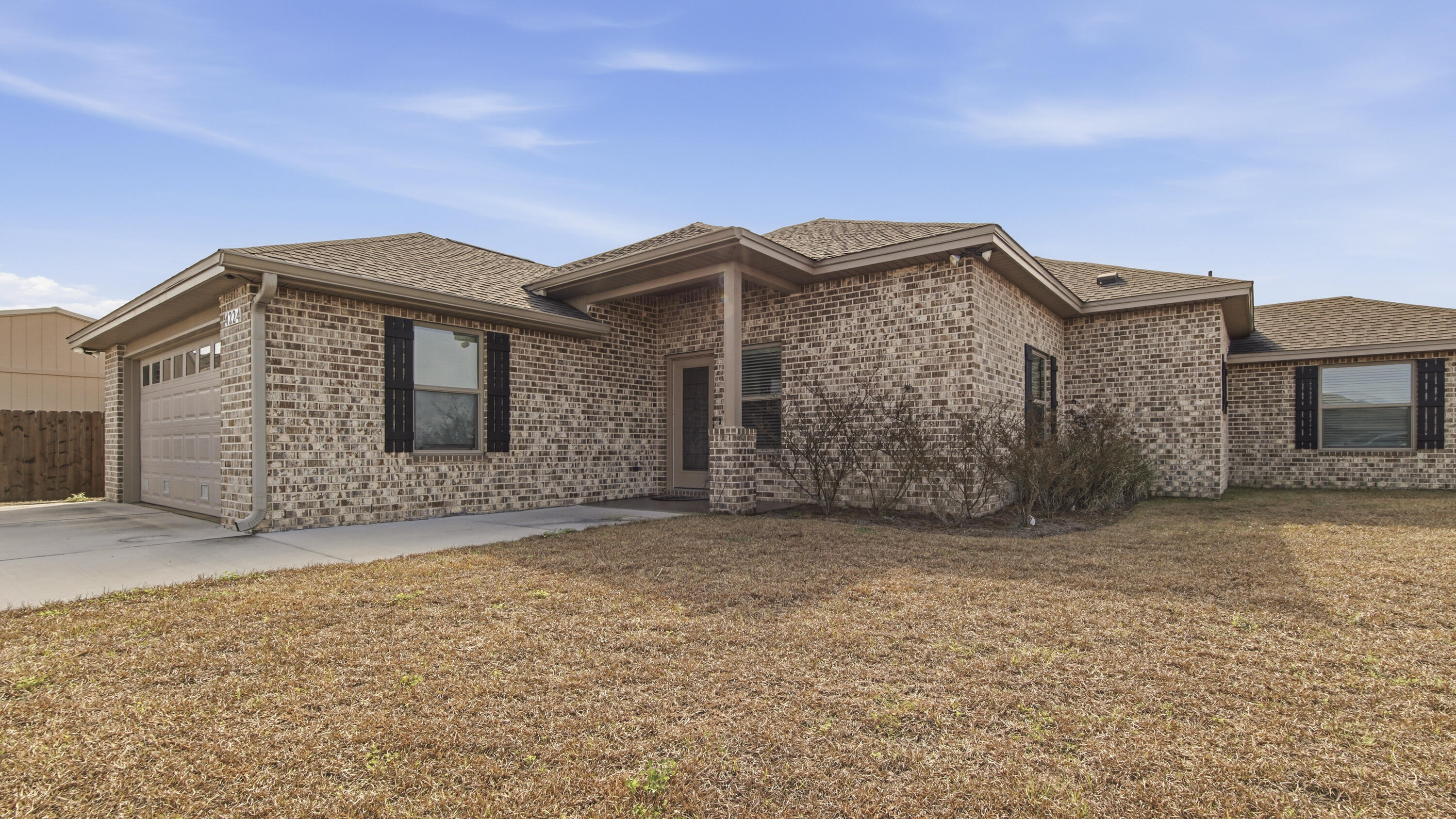 Welcome to 4224 Dairy Farm Road in the welcoming community of Bylsma Manor Estates, conveniently located just off U.S. Highway 231 in Panama City. Built in 2023, this brick home offers 1,848 square feet of beautifully designed living space and has never been lived in -- giving you the rare opportunity to own a truly move-in-ready, like-new home. This 3-bedroom, 2-bath residence features durable vinyl plank flooring throughout and a spacious, open-concept layout ideal for entertaining. The inviting living room showcases a cozy electric fireplace and flows seamlessly into the kitchen and dining area. The kitchen is both stylish and functional with granite countertops, stainless steel appliances, white shaker-style cabinetry, and a breakfast bar perfect for casual meals or gatherings.