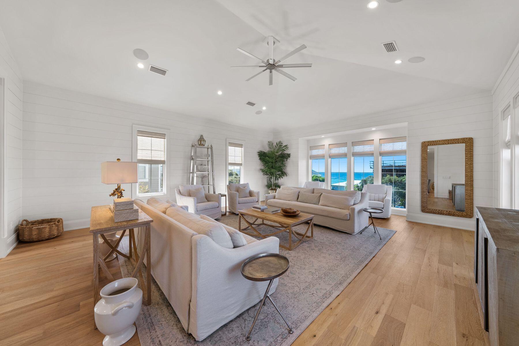 This well-appointed 7-bedroom, 7 full-bath, 3 half-bath coastal residence offers an exceptional blend of space, functionality, and prime 30A location--with no HOA and just a short walk to two public beach accesses. Thoughtfully designed for comfort and versatility, the home features two bunk areas, two separate living rooms, and multiple balconies, creating generous gathering spaces while still allowing for privacy--ideal for hosting large groups. Set on an oversized lot, the outdoor living experience is a true standout. A large heated pool, summer kitchen, and private backyard oasis shaded by mature oak trees provide the perfect setting for relaxed afternoons and evenings after the beach. The third-floor living room and kitchen serve as the heart of the home, capturing stunning Gulf views and offering a natural space for entertaining. Anchored by a 14-person dining table and ample bar seating, the chef's kitchen is equipped with stainless steel appliances, custom cabinetry, abundant storage, and designer finishes that balance style with functionality. An elevator offers convenient access to all three levels. The first floor includes a spacious mudroom with built-in cubbies and a washer and dryer, while two additional laundry areas on the upper levels make hosting guests effortless. Ideally located on the east end of 30A, between Alys Beach and The Big Chill, you're moments from dining, boutique shopping, and entertainment. With proven rental performance generating approximately $270,000-$315,000 annually, this property presents a compelling opportunity as a second home or investment along one of 30A's most sought-after corridors.