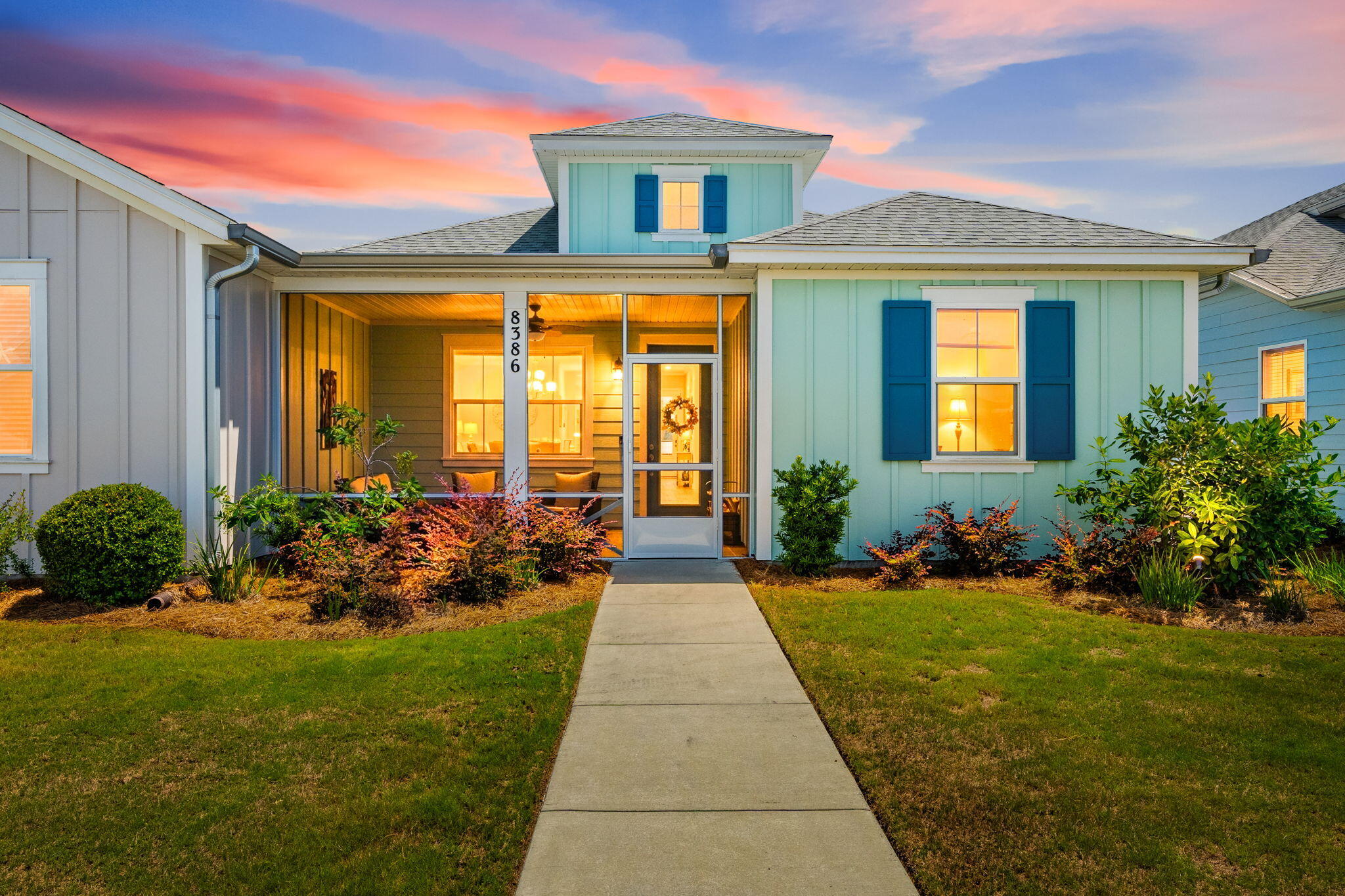 Welcome to Latitude Margaritaville Watersound, where resort-style 55+ living meets coastal comfort at 8386 Jollymon Way. This move-in-ready Camelia floor plan offers the easy, low-maintenance lifestyle buyers want, without the wait for new construction.

From the inviting covered front porch to the bright, open interior, this beach cottage is designed for relaxed everyday living. The popular Camelia layout features more than 1,300 square feet of well-planned space with vaulted ceilings in the main living area and luxury vinyl plank flooring throughout for a clean, coastal feel. The kitchen is thoughtfully appointed with stainless steel appliances, granite countertops, and soft-close shaker cabinetry, creating a stylish and functional space for cooking and entertaining.

The spacious primary suite provides a comfortable retreat with a walk-in closet and private en-suite bath. Additional living areas offer flexibility for guests, hobbies, or a home office.

A golf cart is included with the home, along with a brand-new lithium battery, making it easy to enjoy the community's signature lifestyle. Ride the golf cart path located minutes from your front door to Town Square and take advantage of the amenities that make Latitude Margaritaville Watersound so desirable, including the Paradise Pool, Latitude Bar & Chill, Fins Up! Fitness Center, pickleball and tennis courts, amphitheater, and dog parks.