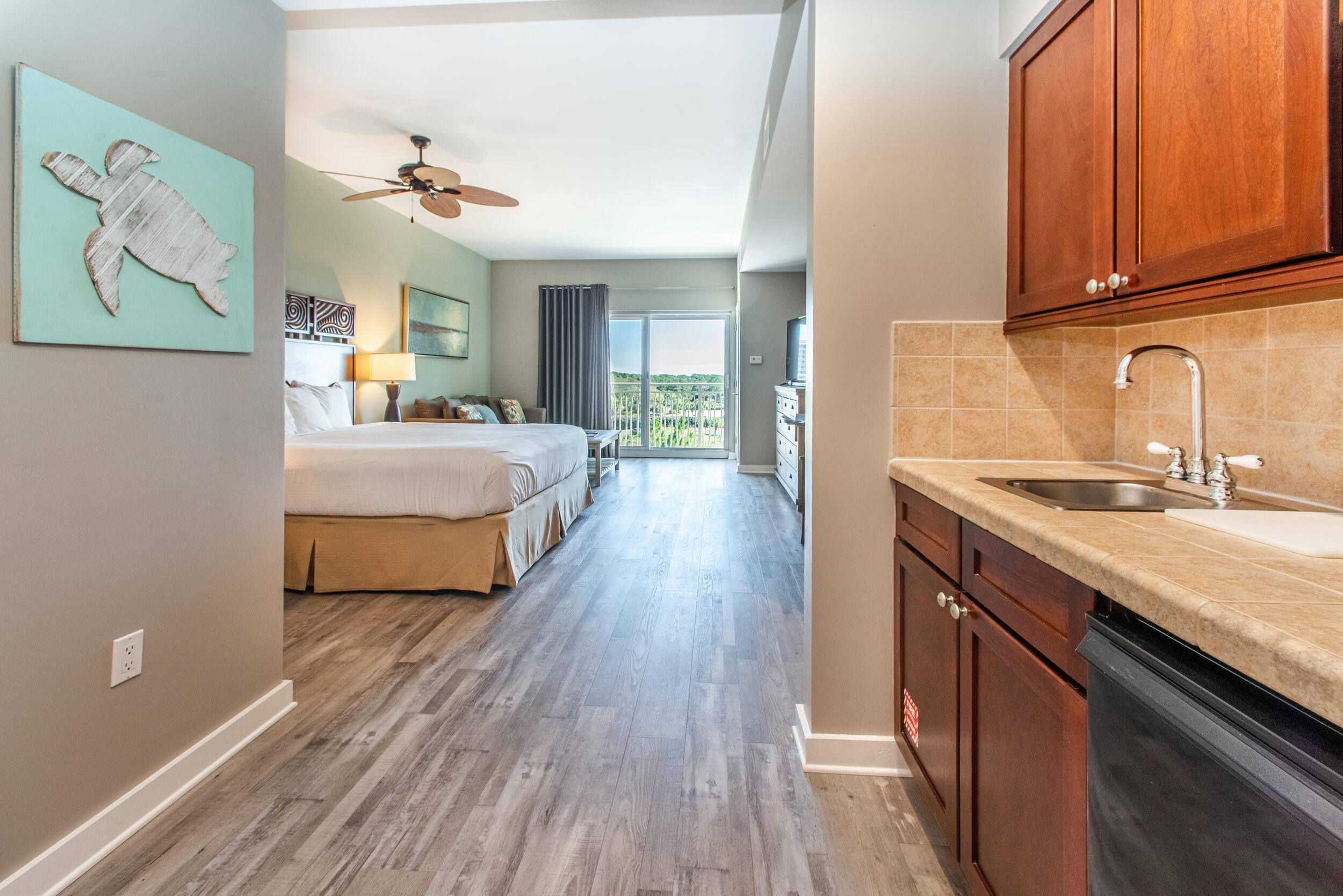 Are you ready to enjoy the resort lifestyle with your own beach condo? Located in Sandestin Resort- Luau is the place for you. Luau is a three minute walk to the famed beaches of the Florida Gulf coast. This condo has been updated with new LVP flooring, is fully furnished and rental ready. This turnkey property is primed for rental opportunities, catering perfectly to couples, business travelers, golf enthusiasts, and young families alike. The well-appointed layout includes a spacious king-sized bed and a convenient sleeper sofa, ensuring comfort and versatility for all guests. The Luau offers a sprawling pool with waterfall, hot tub, fitness center, and an inviting grilling area. Buyer to verify all dimensions.