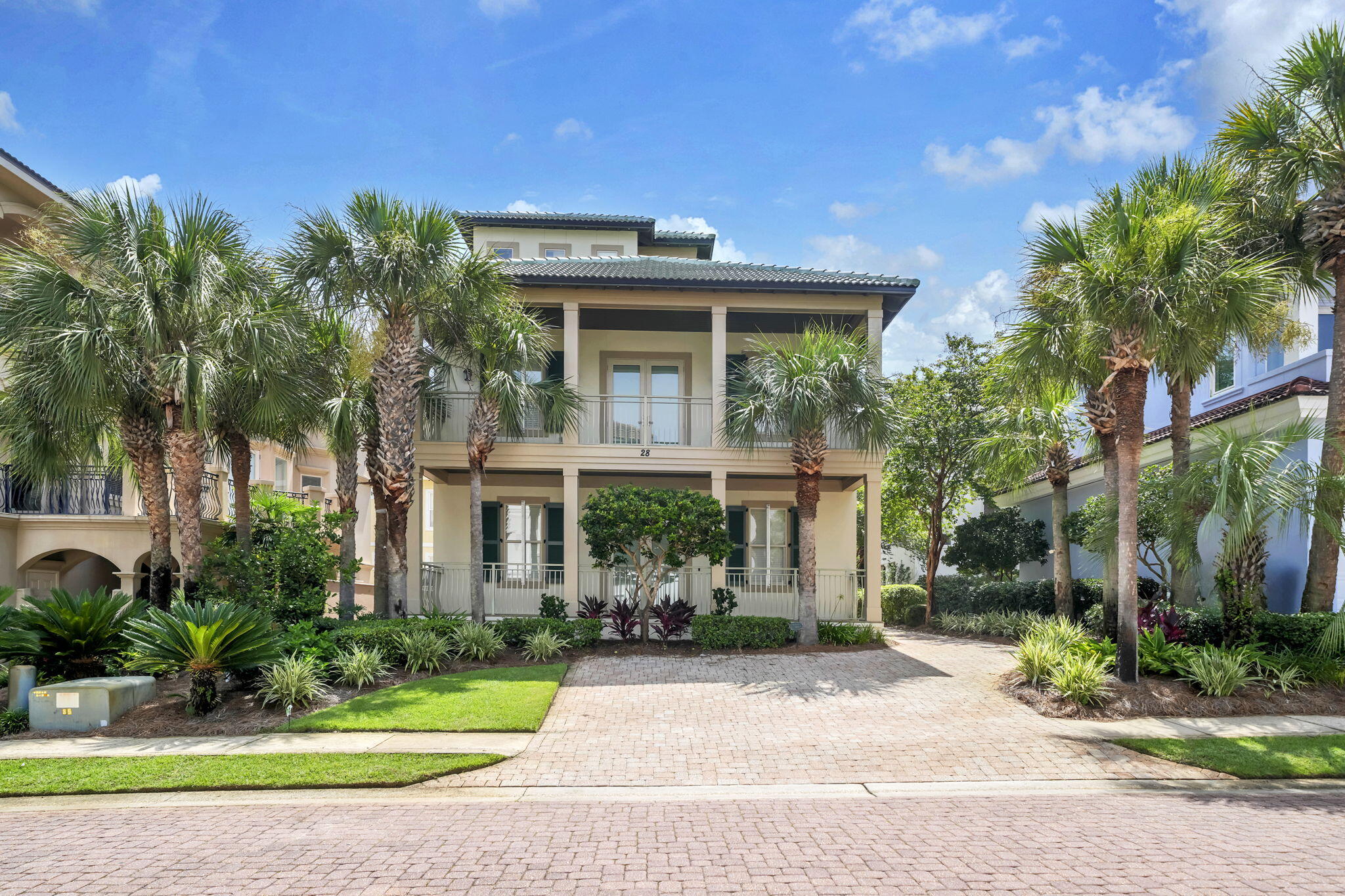 Rarely does a home of this caliber become available in Destiny By The Sea. Perfectly positioned just three homes from the sugar-white sands and emerald waters of the Gulf, this exceptional 5-bedroom, 4.5-bath residence offers 2,814 square feet of beautifully maintained living space within one of Destin's most prestigious guard-gated beachfront communities.

28 Varazze Cay has been lovingly maintained as a lightly used private second home and every detail reflects an extraordinary level of pride of ownership. This is a home that has been meticulously cared for, thoughtfully updated, and preserved in truly exceptional condition.

Designed for effortless coastal living, the spacious three-level floor plan offers an ideal balance of elegance and functionality. The main living level features soaring ceilings, beautiful stone flooring, an inviting living area, and an open-concept design that flows seamlessly into the dining area and well-appointed kitchen. Complete with quartz countertops, abundant cabinetry, a large breakfast bar, and a charming breakfast nook, the kitchen is equally suited for entertaining or everyday living. A highly desirable main-level guest bedroom adds convenience and flexibility, while the remaining bedrooms provide generous accommodations for family and guests. Multiple covered balconies invite you to enjoy the Gulf breeze, with peekaboo Gulf views from the upper level providing the perfect backdrop for morning coffee or spectacular sunsets.

Beyond its timeless design, this home has received an impressive list of recent improvements that set it apart from the competition. Major updates include a new tile roof (2025) with a 10-year transferable workmanship warranty, new exterior doors, new blinds, a new garage door and opener, freshly painted exterior (July 2026), and a new ice machine. The high-efficiency Carrier variable-speed HVAC system has been professionally serviced twice annually, with the exterior unit replaced approximately three years ago and protected with a specialized coastal coating for enhanced durability. Regular pest control and termite prevention treatments further reflect the owner's unwavering commitment to preventative maintenance and long-term care.

Residents of Destiny By The Sea enjoy an unmatched coastal lifestyle with 24-hour guarded gate security, private deeded beach access boardwalk, a resort-style community pool, hot tub and beautifully landscaped grounds - all just steps from one of the Emerald Coast's most spectacular stretches of beach.

Ideally located along Scenic Gulf Drive, you'll be minutes from Destin's finest dining, championship golf, boating, world-class fishing, Destin Commons, Grand Boulevard, Baytowne Wharf, HarborWalk Village, and Silver Sands Premium Outlets.

Whether you're searching for an exceptional primary residence, an exclusive coastal retreat, or a premier investment in one of Destin's most coveted beachfront communities, 28 Varazze Cay presents a truly rare opportunity. Homes this close to the beach are always in demand - but finding one that has been extensively updated and maintained to such exacting standards is exceptionally uncommon. Buyer to verify all information.