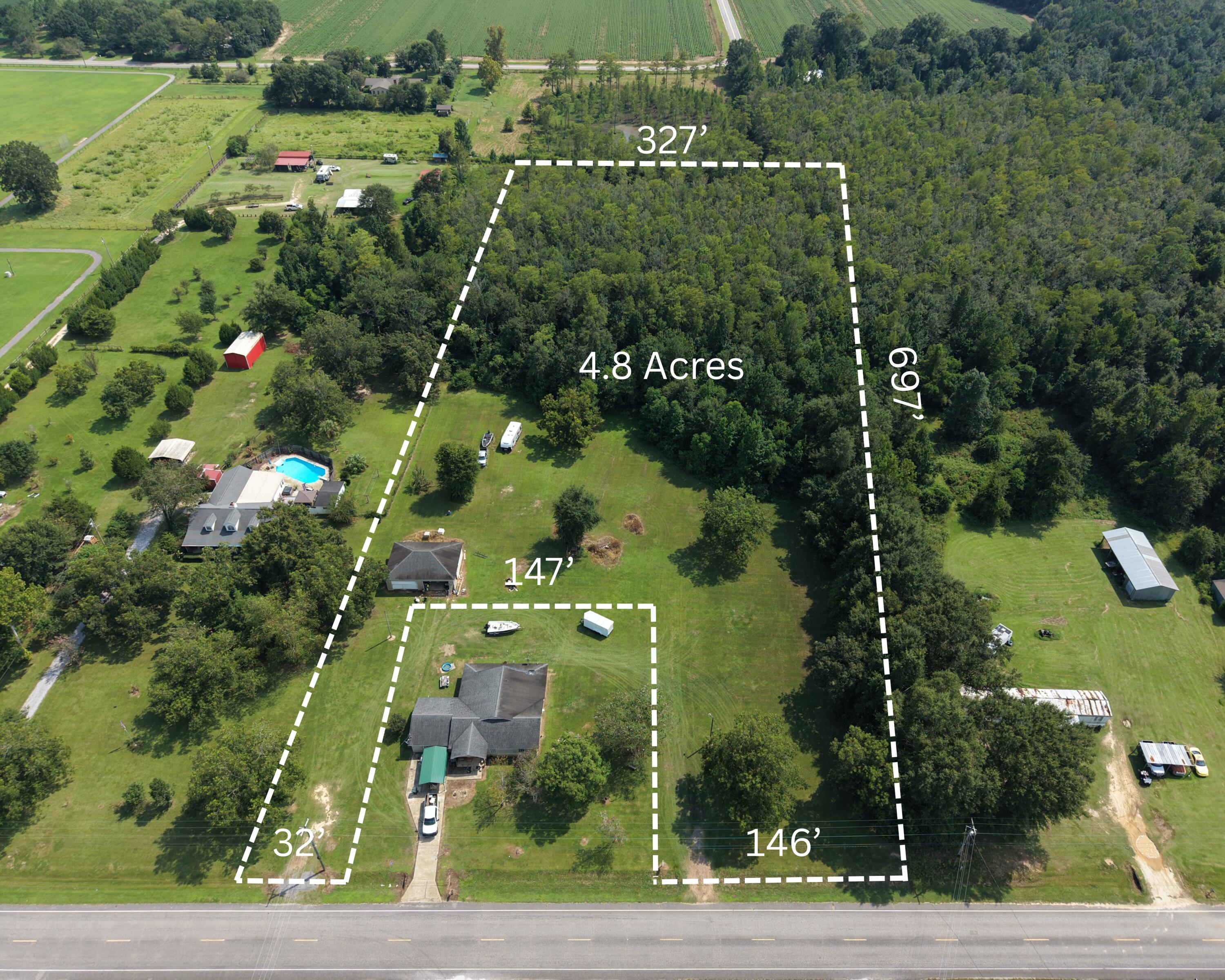 4.8 acres on Hwy 4 with over 175' of road frontage! The property features 2 acres of cleared, buildable land located in Flood Zone X, making it an ideal homesite for your future country retreat. With two driveway access points already in place, you'll have flexibility when planning your home placement and access.

City water and power are available at the road, helping simplify the building process.

The rear 2.8 acres consist of natural wetlands, providing a peaceful natural buffer that attracts wildlife and offers added privacy behind your homesite.

Conveniently located just steps from Travis Nelson Park and approximately ¼ mile from Northview High School & Bratt Elementary School, this property combines rural space with nearby community amenities.

Cont... Whether you're planning to build a custom home, weekend getaway, or simply want space to enjoy country living, this property offers both privacy and convenience. Located just 10 minutes from Atmore, Alabama and 15 minutes from Interstate 65, you'll have quick access to nearby towns while still enjoying the quiet of rural living.