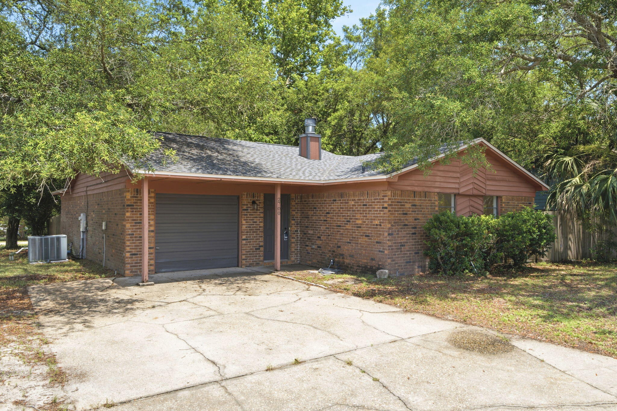 Move-In Ready with Major Updates! Located in the desirable Sandpiper neighborhood, this home is within walking distance of Sandpiper Village Park on Escambia Bay, featuring a fishing pier, playground, picnic areas, grills, and beautiful sunset views.  Offering 3 bedrooms, 2 bathrooms, and a versatile flex room that can serve as a 4th bedroom, office, dining room, or playroom, this home has space to fit your needs. Major updates include a new roof and interior HVAC unit (2022), fresh interior paint, and new flooring throughout (approximately one year old). The open kitchen features granite countertops, newer appliances, and overlooks the spacious living room with a wood-burning fireplace and sliding doors leading to a private patio.  Additional features include smooth ceilings (no popcorn), a brick exterior, mature live oaks, a privacy-fenced backyard, and a sprinkler system on a separate well to help reduce water costs. Located in Flood Zone X, no flood insurance is currently required. The home also includes transferable termite protection with a termite damage bond.  Conveniently located just 11 minutes to Pensacola Beach, 20 minutes to Downtown Pensacola, and 34 minutes to Navarre Beach. Schedule your private showing today!