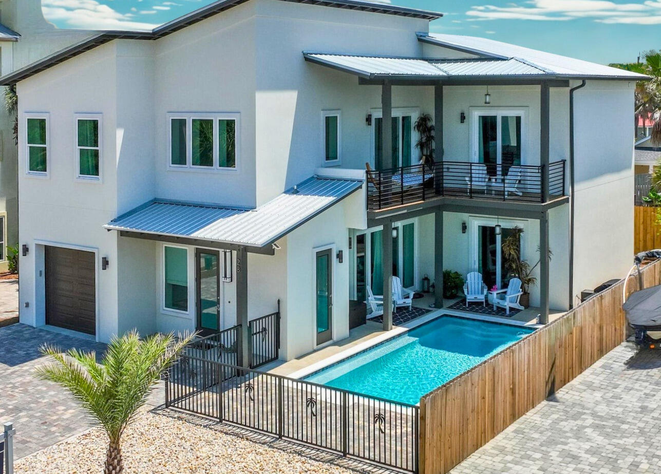NO HOA • Built to Last • Walk to the Beach • Furnished & Rental Ready -- See It Before It's Gone!

This is your opportunity to own a truly exceptional custom-built home in prestigious Frangista Beach--without HOA fees. Built in 2022 with solid poured concrete construction, this home offers a rare combination of luxury, durability, energy efficiency, and low-maintenance ownership that savvy buyers and investors are looking for.

Just a 5-minute walk to deeded beach access, this stunning residence welcomes you with a dramatic 28-foot foyer and an expansive open-concept floor plan designed for entertaining and effortless coastal living. As sunlight pours through the home, the sparkling chandelier creates a breathtaking first impression you'll never forget.

Inside, you'll find two spacious living areas, giving family and guests plenty of room to relax and gather. Every bedroom features its own private ensuite bath, while the luxurious primary suite can be found on either the main or second level, both offering beautiful views of the heated saltwater pool.

Step outside to your oasis where a heated saltwater pool with an oversized 25-foot tanning bench invites endless days of relaxation and grilling. Massive pocketing impact glass doors on both levels seamlessly blend indoor and outdoor living, creating the ultimate Florida lifestyle experience.

Being sold furnished (with only a few personal and antique exclusions), this property is ready to enjoy!  CALL LESLIE
850-502-3988