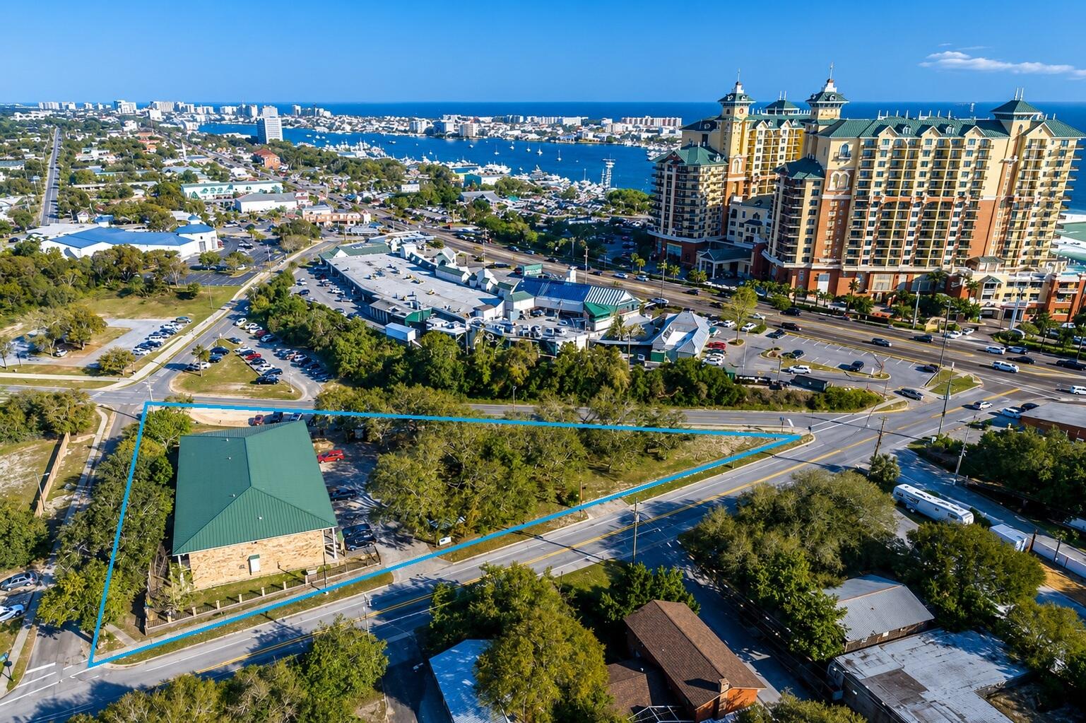 Income producing 22 Unit Multifamily Property with land near Harborwalk and McGuire's. There is additional revenue potential for a buyer who wishes to utilize the land as paid public parking. Please do not disturb tenants.