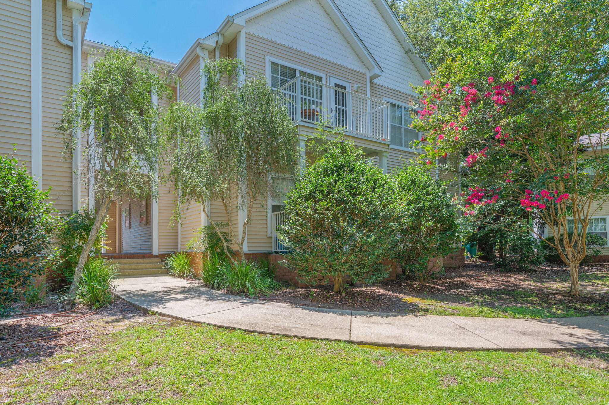 This charming first-floor 2-bedroom, 2-bath condo overlooks the community pool, beautifully maintained landscaping, mature oak trees, and a picturesque gazebo. The open-concept floor plan is filled with natural light and features durable LVP flooring throughout.

The spacious primary suite easily accommodates a king-size bed and includes a walk-in closet plus a private en-suite bath with cultured marble countertops and a tub/shower combo. The generously sized second bedroom is conveniently located near the hall bath featuring a walk-in shower.

Relax on the covered patio while enjoying peaceful views of the sparkling community pool. Additional updates include HVAC replaced in 2015 and water heater replaced in 2018.

The Oaks offers a prime Niceville location close to military bases, top-rated schools, shopping, dining, entertainment, and the stunning white-sand beaches of Destin.