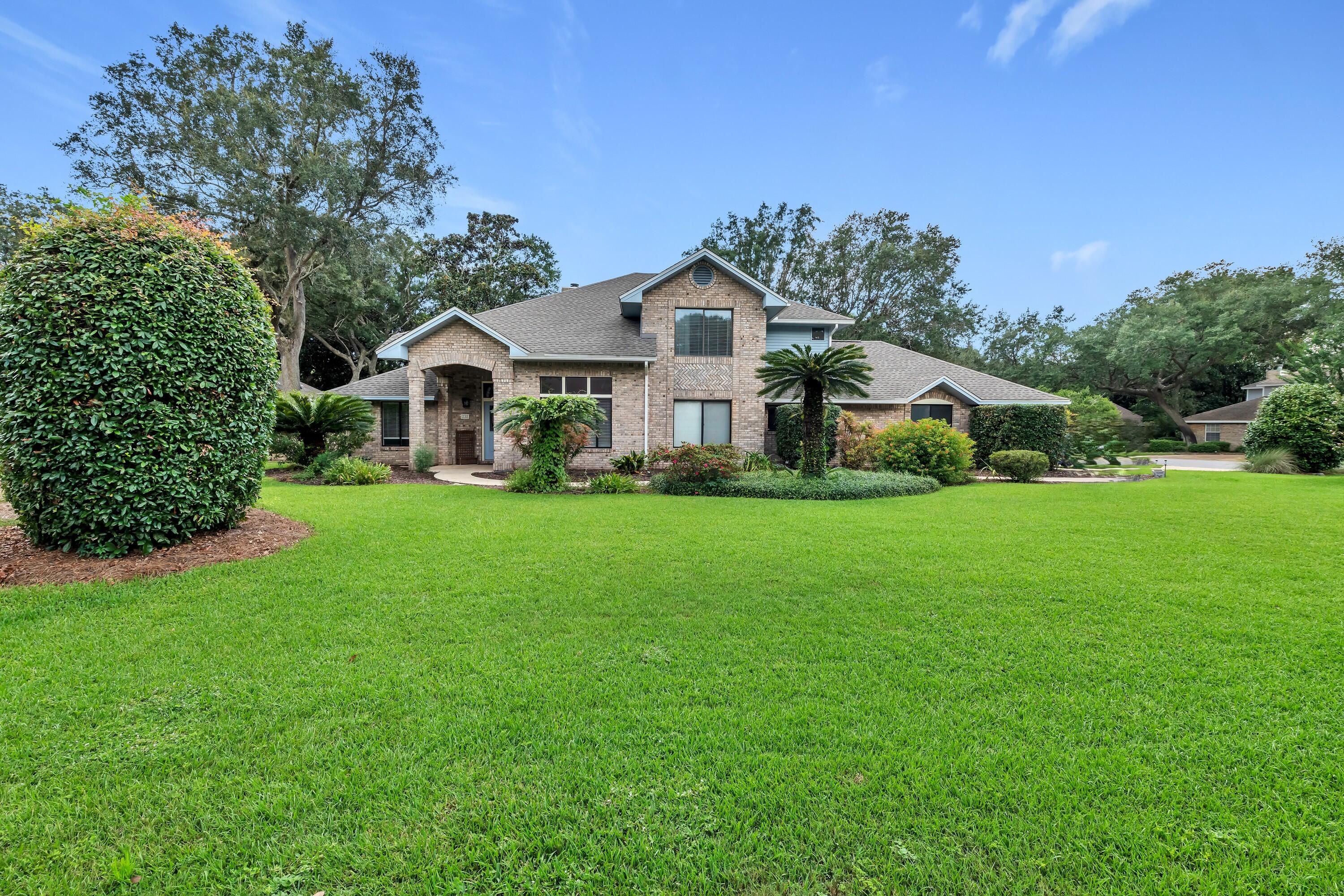 Beautiful executive home located in one of Bluewater Bay's premier gated waterfront communities, featuring a private beach and community dock perfect for swimming, paddleboarding, and kayaking. Situated on a spacious corner lot, this exceptional home offers a private pool, covered back porch, and fully fenced backyard--ideal for entertaining and enjoying the Florida lifestyle.

Inside, soaring two-story ceilings create an impressive sense of space in the family room, which flows seamlessly into the updated kitchen. The kitchen features white cabinetry, granite countertops, stainless steel appliances, and a large walk-in pantry.

The spacious first-floor primary suite offers a large walk-in closet with custom built-ins and a beautifully renovated primary bathroom featuring a spa tub, dual vanities, and a stunning walk-in stone shower with built-in seating. Two additional bedrooms and a full bathroom are also located on the first floor, along with a versatile flex room that can be used as an office or additional living space.

Upstairs, you'll find two additional bedrooms, a loft, and a Jack-and-Jill bathroom. The expansive covered back porch overlooks the private swimming pool and spacious fenced backyard, providing plenty of room for outdoor entertaining!

 Additional features include a large driveway with ample parking and a cul-de-sac area. This exceptional property combines generous living space, thoughtful updates, and access to outstanding waterfront amenities in a highly desirable Bluewater Bay location.

**Major Upgrades include carpet, paint, trim, custom shelving, added 5th bedroom, pool safety fence, backyard fence, interior doors, primary bath & upstairs bath remodel, ceiling fans, 2021 roof & 2021 water heater.

Schedule a showing today!