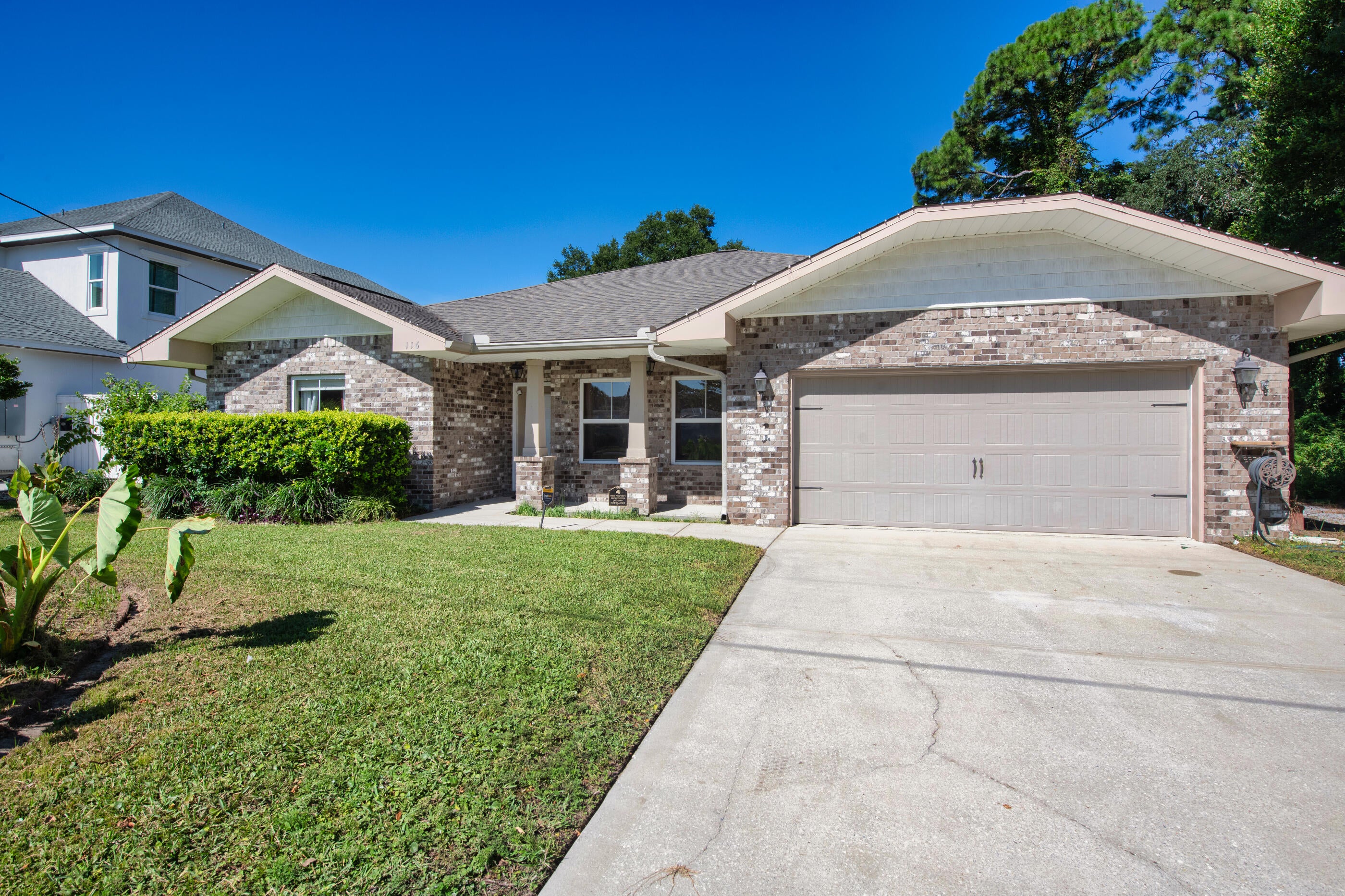 Some homes simply check the boxes. Others make you immediately picture your life there.

Pull up to 116 Wellington Road and you get that feeling right away. The brick exterior, welcoming front porch, and quiet residential setting create the kind of first impression that feels established, comfortable, and easy to come home to. Step inside, and the home opens into a thoughtfully designed one-story layout where everyday living feels effortless.
The heart of the home is the spacious great room. Raised ceilings, crown molding, recessed lighting, and hardwood floors create an inviting setting for everything from slow mornings with coffee to evenings gathered with family and friends. There is room to spread out without losing that comfortable sense of connection.

Move into the kitchen and you'll find a space designed for someone who actually enjoys being at home. The gas range, granite countertops, maple cabinetry, stainless appliances, breakfast bar, and pantry provide both the style and functionality needed for everyday meals or entertaining. The natural flow between the kitchen, dining area, and great room means the cook never has to miss the conversation. When the day winds down, the primary suite offers a quieter place to retreat. The spacious bedroom provides plenty of room to create your own comfortable sanctuary, while the private bath features a double vanity, garden tub, separate shower, and walk-in closet. The split-bedroom design gives additional rooms their own sense of privacy, making the home equally suited for a growing household, guests, a home office, or whatever life calls for next.
Then step outside.

The covered patio leads to a privacy-fenced backyard that gives you something increasingly valuable -- your own outdoor space. Picture weekend barbecues, kids or pets playing in the yard, or simply sitting outside at the end of the day while enjoying a little fresh air. The irrigation system and lawn pump help make maintaining the yard easier, while the covered patio gives you another place to enjoy it.

The home's practical features are just as appealing as its aesthetics. A two-car attached garage provides everyday convenience, while natural gas, a tankless gas water heater, central air, double-pane windows, and a functional laundry area add comfort and efficiency to the daily routine.
And then there's the location.

Set within Colonial Estates in the Ocean City area of Fort Walton Beach, 116 Wellington Road offers a convenient home base for enjoying everything the area has to offer. The property is positioned off Eglin Parkway with access toward the surrounding Fort Walton Beach community, while the broader area is closely connected to both Eglin Air Force Base and Hurlburt Field, making it especially appealing for military families, defense professionals, and others who want to stay connected to the region's major employment centers.

The neighborhood itself offers the feeling of an established residential community rather than a home tucked away from everything. Daily conveniences, schools, shopping, dining, and the beaches and attractions of the Emerald Coast are all part of the lifestyle that comes with calling Fort Walton Beach home.
Maybe you're relocating to the area and want a home that feels comfortable from the moment you arrive. Maybe you're looking for a one-story layout that gives everyone their own space without unnecessary stairs. Or maybe you've simply reached the point where you want a home that feels finished, functional, and easy to enjoy.

Walk through the front door and imagine your mornings in the kitchen. Picture dinner conversations flowing into the great room. Imagine opening the back door on a beautiful Florida afternoon and stepping onto the covered patio. Think about having a private backyard, a comfortable primary suite, a practical garage, and a home designed around the way people actually live.

116 Wellington Road isn't just a place to live. It's a place to settle in, make it your own, and enjoy the everyday lifestyle that makes Fort Walton Beach such a special place to call home.