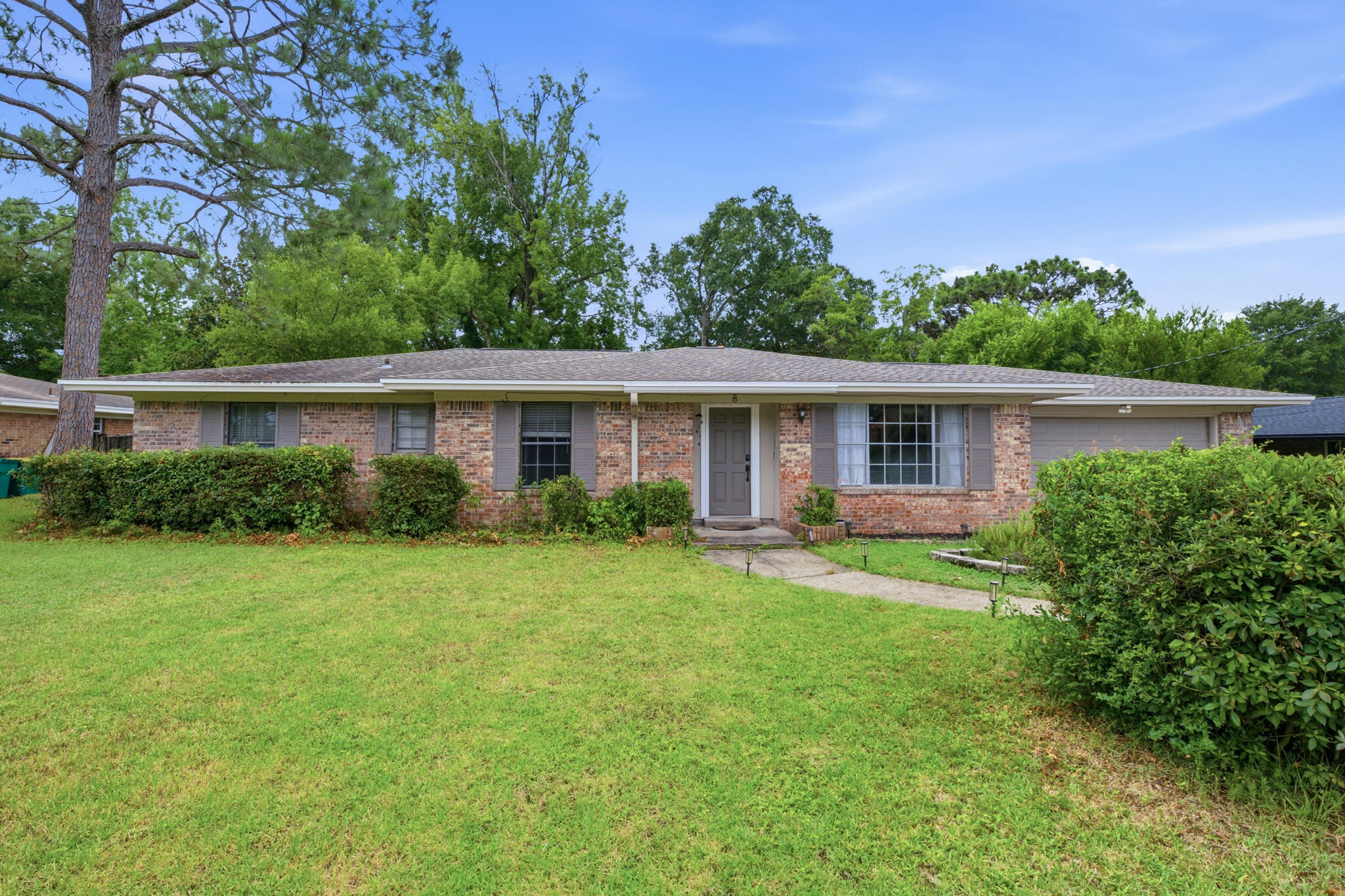 Nestled in the heart of Shalimar, this charming all-brick 4-bedroom, 2-bathroom home offers the perfect blend of comfort, style, and convenience with no HOA. Located just minutes from Eglin Air Force Base, schools, downtown Fort Walton, shopping and dining, and the beautiful beaches. Outdoor enthusiasts will also appreciate being less than 2 miles from the Poquito Boat Ramp for quick access to the water.

Inside, you'll find two spacious living areas filled with an abundance of natural light, creating a warm and inviting atmosphere. Beautiful hardwood floors, elegant crown molding, and a classic brick wood-burning fireplace add timeless character throughout the home. The kitchen features granite countertops, stainless steel appliances, breakfast bar, and ample space for cooking and entertaining. With four spacious bedrooms and two full bathrooms, this thoughtfully designed home provides plenty of room for everyday living and hosting family and friends. The durable all-brick exterior offers timeless curb appeal and low-maintenance living, while the absence of an HOA provides added flexibility and freedom. Don't miss the opportunity to own this exceptional home in one of Shalimar's prime locations.