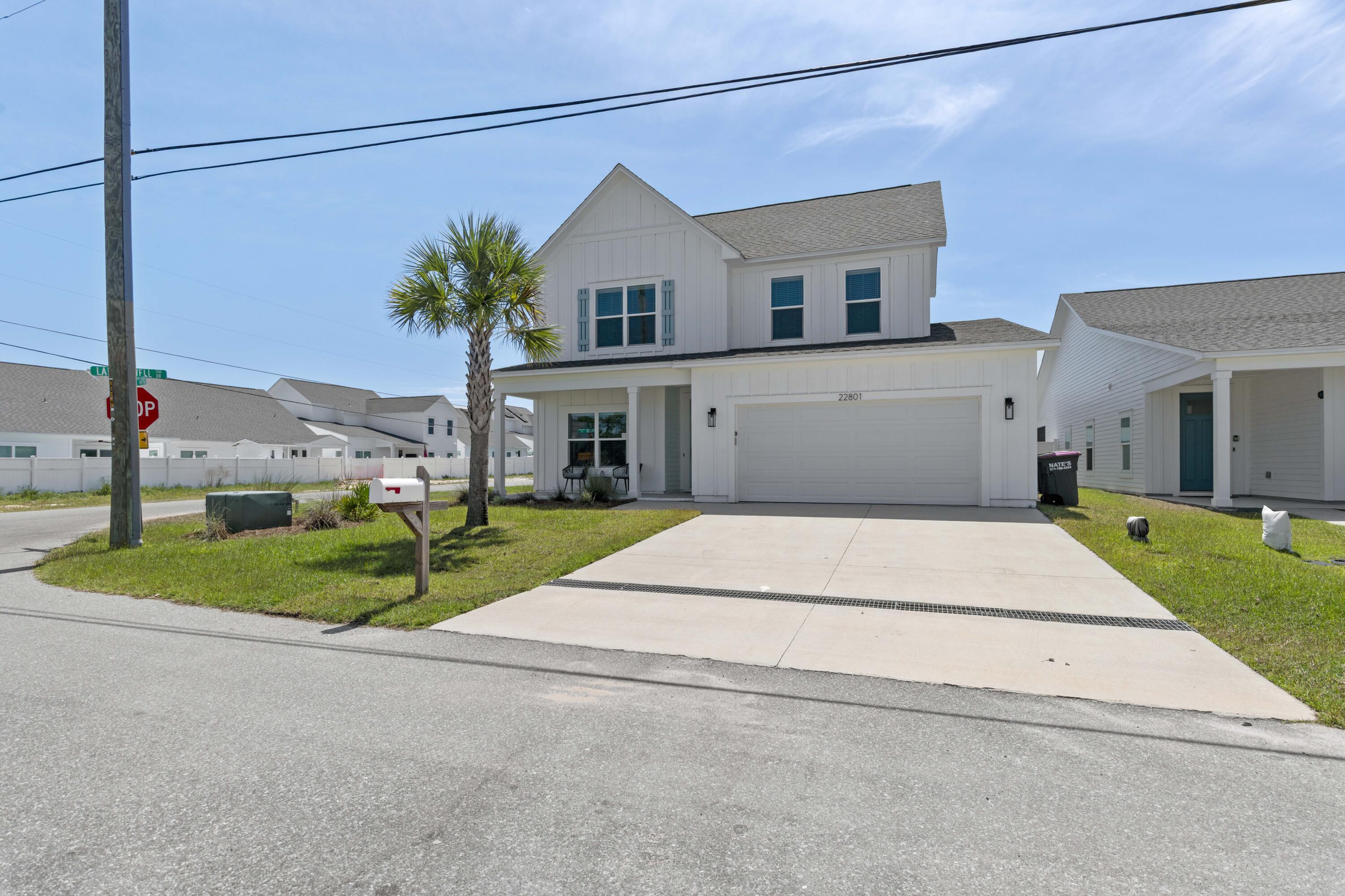 Located in the sought-after community of The Preserve at Lake Powell, this beautifully designed 4-bedroom, 3-bath home offers spacious coastal living just minutes from the sugar-white sands of the Emerald Coast. The open-concept floor plan features a stylish kitchen with granite countertops, stainless steel appliances, and a large center island overlooking the main living area--perfect for entertaining or everyday living.

The main level includes two bedrooms, highlighted by a luxurious primary suite with double vanities, a walk-in tile shower, and an oversized walk-in closet. Upstairs, you'll find two additional bedrooms, a full bath, and a versatile loft ideal for a media room, home office, or play space.

Situated on the desirable west end of Panama City Beach, this home offers convenient access to Lake Powell, Camp Helen State Park, multiple public beach accesses, 30Avenue, and Pier Park. Enjoy the perfect blend of comfort, convenience, and coastal lifestyle in one of the area's most desirable locations.