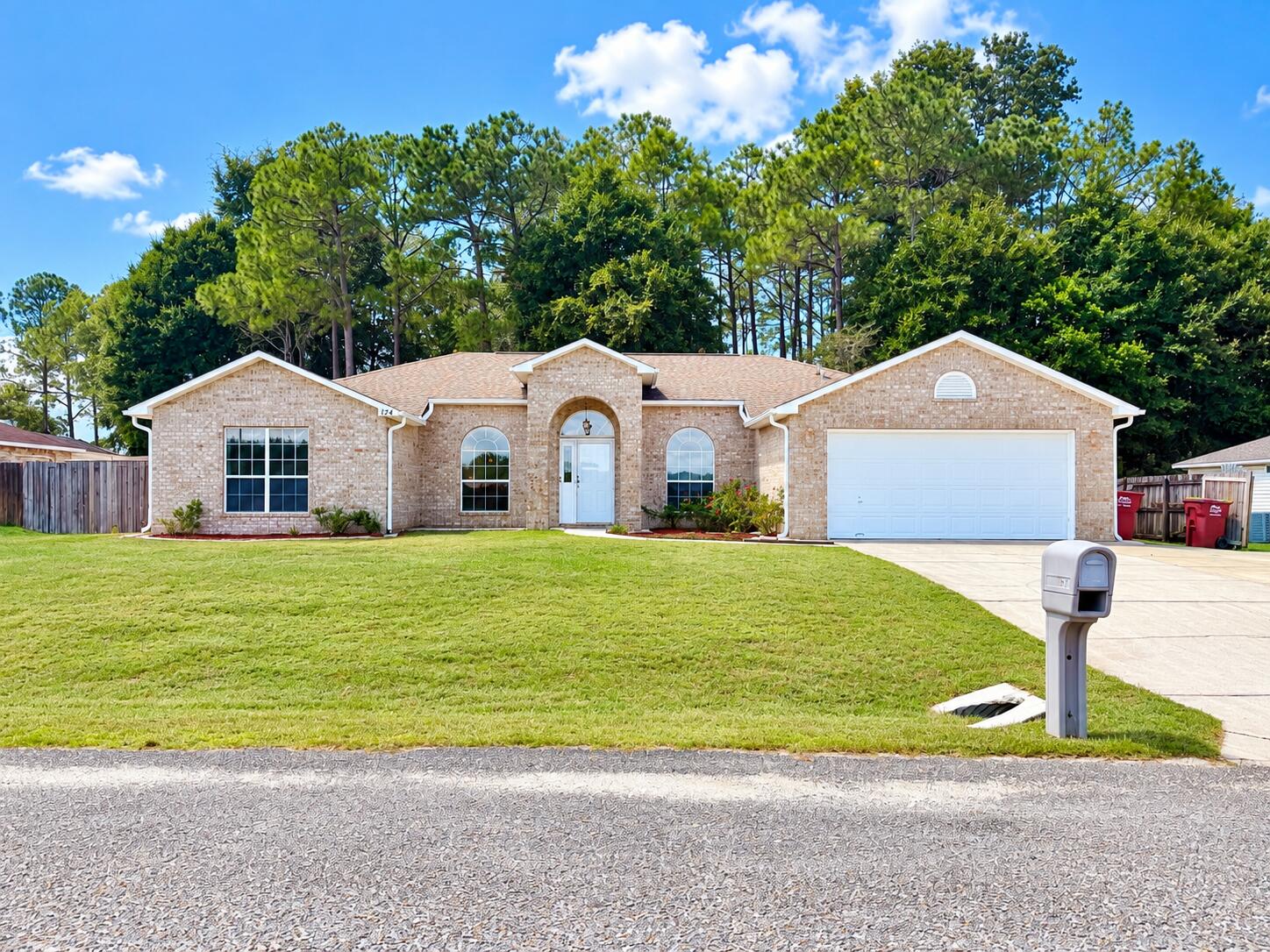 South Crestview! Renovated! NO HOA, room to park Boat or RV! This was a former model home for the builder and features 4 bedrooms plus an office/flex room and formal dining room, a split floor plan with tall ceilings, an enclosed Porch/ Florida room with tile flooring, all new LVP wood look flooring throughout the home and a modern color scheme. The home has been freshly painted and is move in ready! The Roof was replaced in 2017 so no insurance concerns. The driveway has been widened with extra concrete poured to allow for ease of parking multiple vehicles. There is a double gate to access the side yard, providing the perfect spot to park a boat or rv. The kitchen features granite countertops, glass mosaic tile backsplash, a center island, pantry, dining nook, and a window over the sink. The primary bedroom features an ensuite bath with 2 walk in closets, soaking tub, double vanity, and separate tiled shower. on the opposite  side of the home there are 3 generous sized bedrooms and a full bath. The backyard is fenced, and there is a mature tree line across the back offering privacy and shade. If you are looking for an affordable home in a convenient location with easy access to both HWY 85 and the Crestview bypass, this should be at the top of your list. The home provides all the space you need plus an easy commute to area military bases and the beaches of the emerald coast.