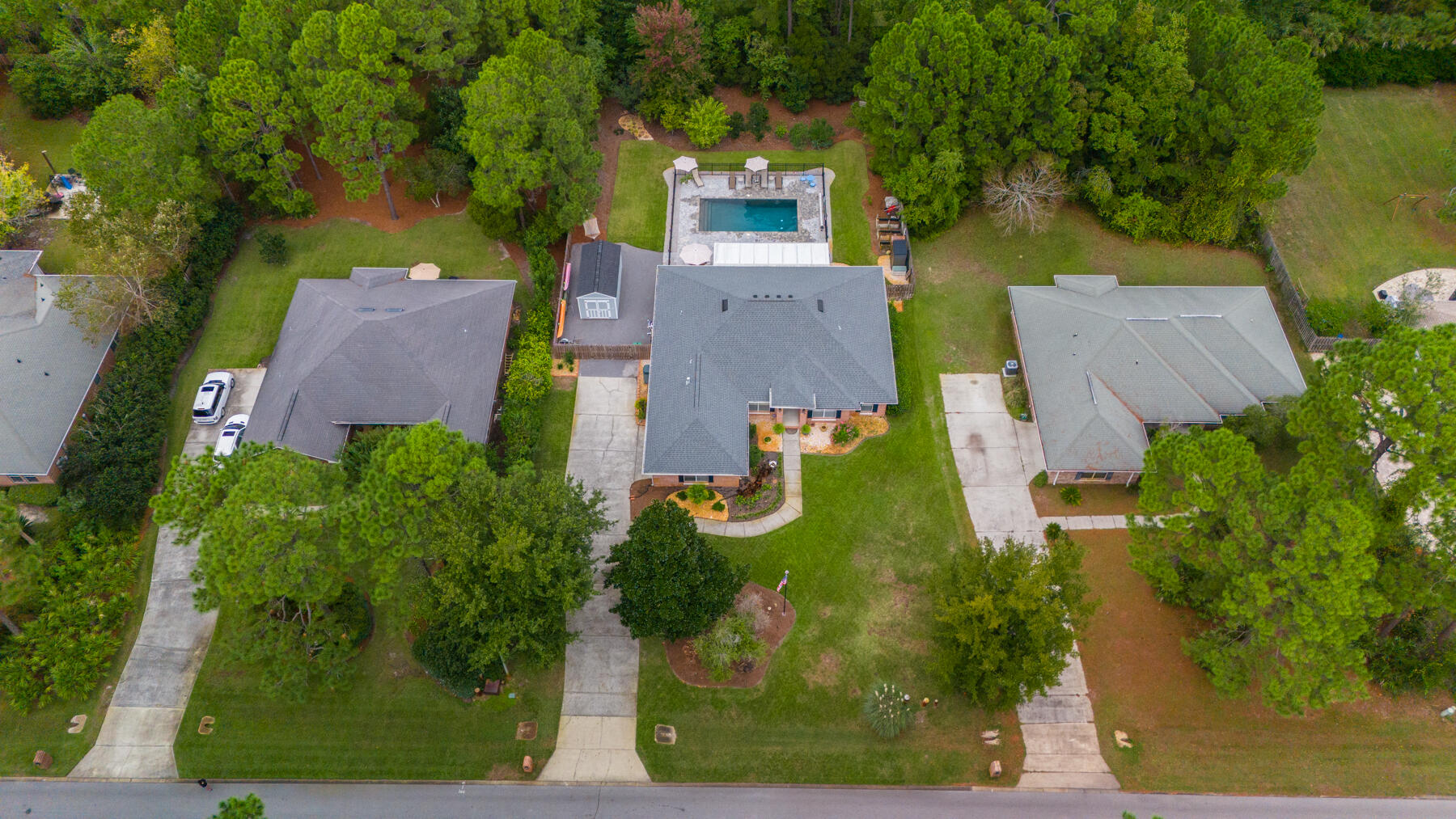 Welcome to your dream home in Driftwood Estates, where luxury and convenience meet. This 2,762 sq. ft. gem features 4 beds, 2 baths, and a ½-acre lot. Enjoy over $150,000 in upgrades including a new heated salt water pool, complete master bath remodel, new kitchen remodel with gas oven, vaulted ceilings, a fireplace, and granite countertops. The master suite includes dual walk-in closets and an elegant bath. New covered and enclosed Florida room. A New 10x20 Storage shed. Enjoy wooded serenity with private green space behind home. Driftwood Estates offers a playground, basketball and pickleball courts and more and is ideally located near the hospital, shopping, beach, public boat launch, and restaurants. Don't miss out on this blend of luxury and convenience! Truly a must see