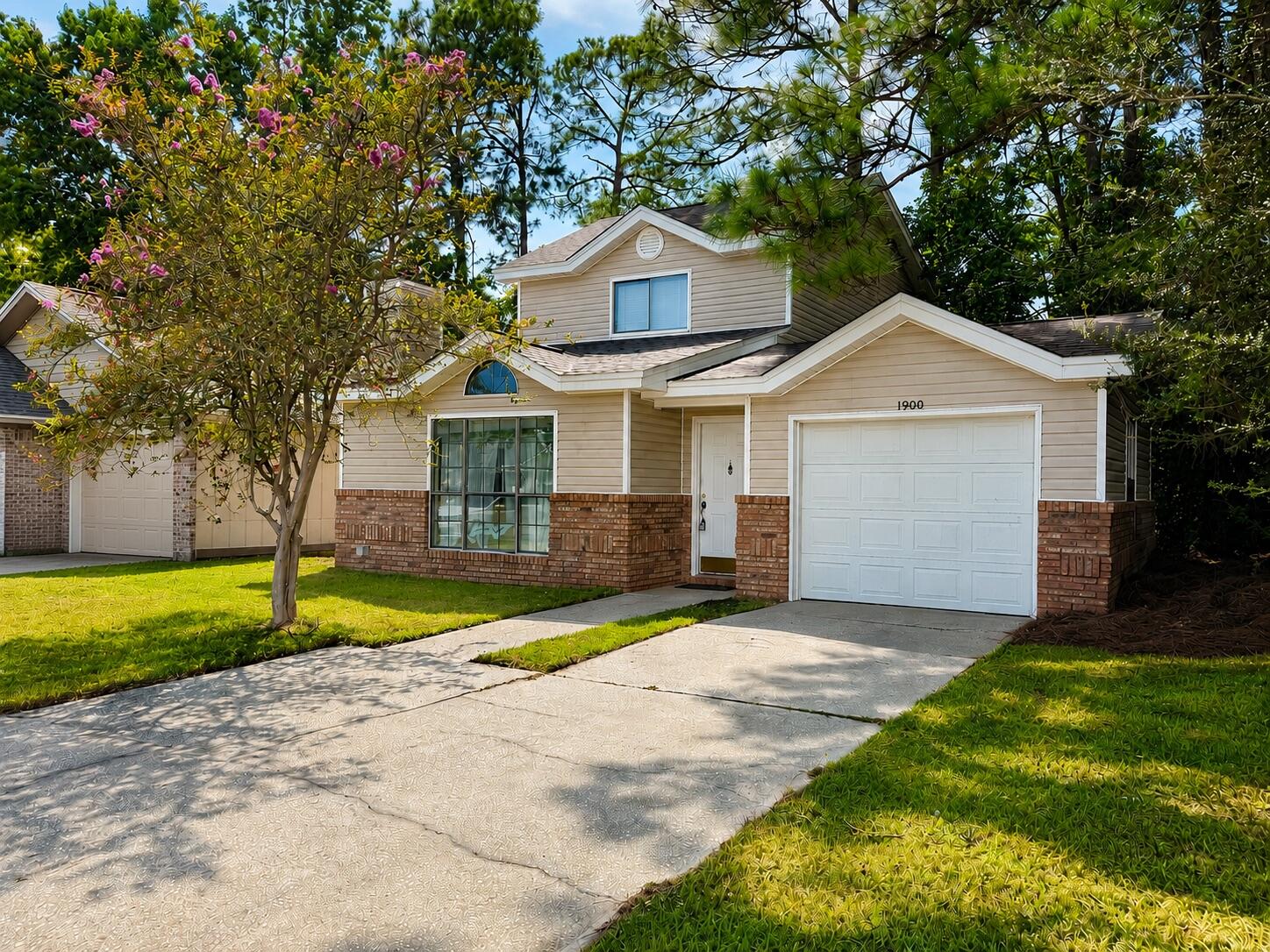 Situated on .12-acre corner lot, this two-story home offers a great opportunity for buyers looking to add their own finishing touches without having to start with the big-ticket items. A wooded area along the property provides additional privacy from the street, giving the homesite a more tucked-away feel than you might expect.

Inside, the floor plan features a desirable downstairs primary bedroom, laminate plank flooring through the main living area, and a wood-burning fireplace that adds warmth and character to the living space. Parking includes a one-car garage plus 2 driveway spaces for your vehicles.

This home is being presented AS-IS and has been priced with a few needed cosmetic updates in mind. Several of the major components have already been taken care of, including a 2024 roof, 2024 HVAC system, and 2023 water heater offering a solid head start for the next owner. The sellers are motivated and welcome creative offers!

With newer major systems, a private corner setting, and plenty of potential to update the interior to your own taste, this could be a great opportunity to build equity and make a home your own by simply adding new flooring and paint.